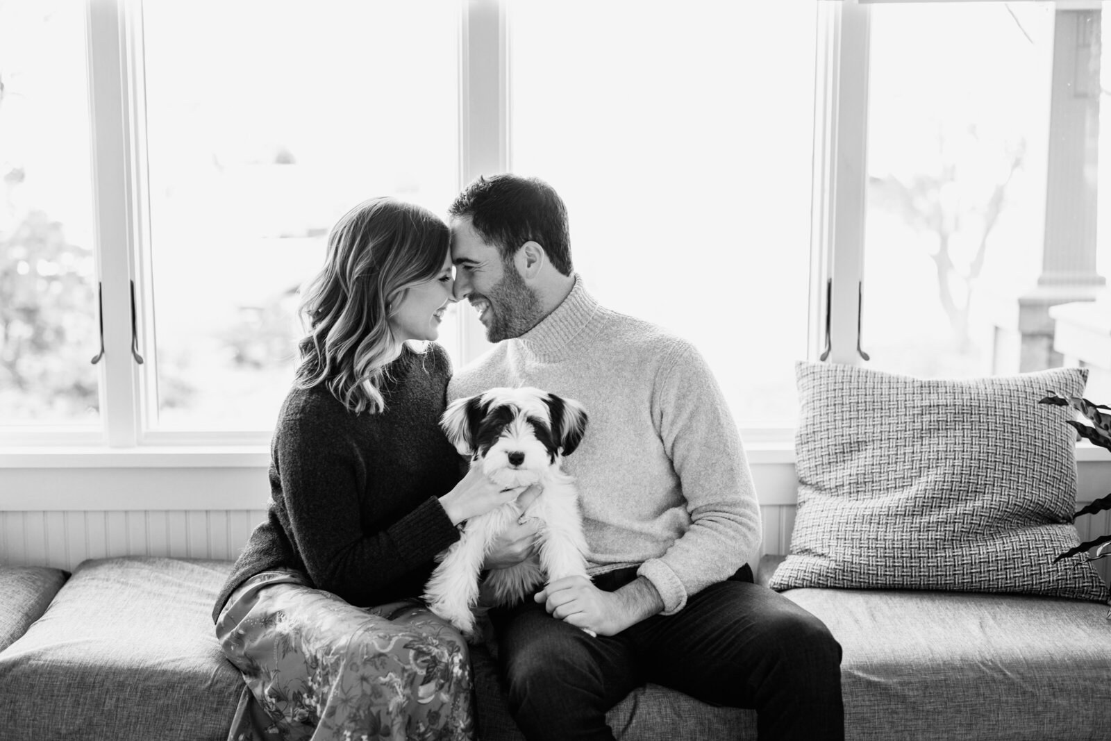 couple at modern home with dog