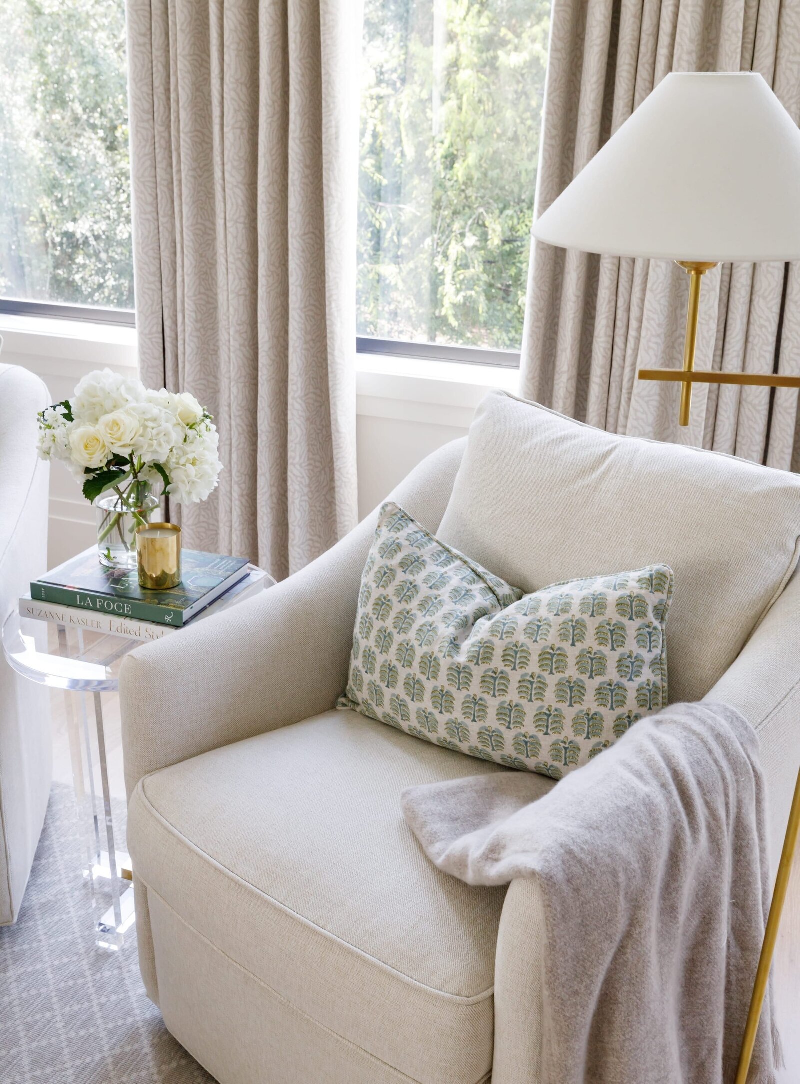 vision and hammer white chair with curtains on windows