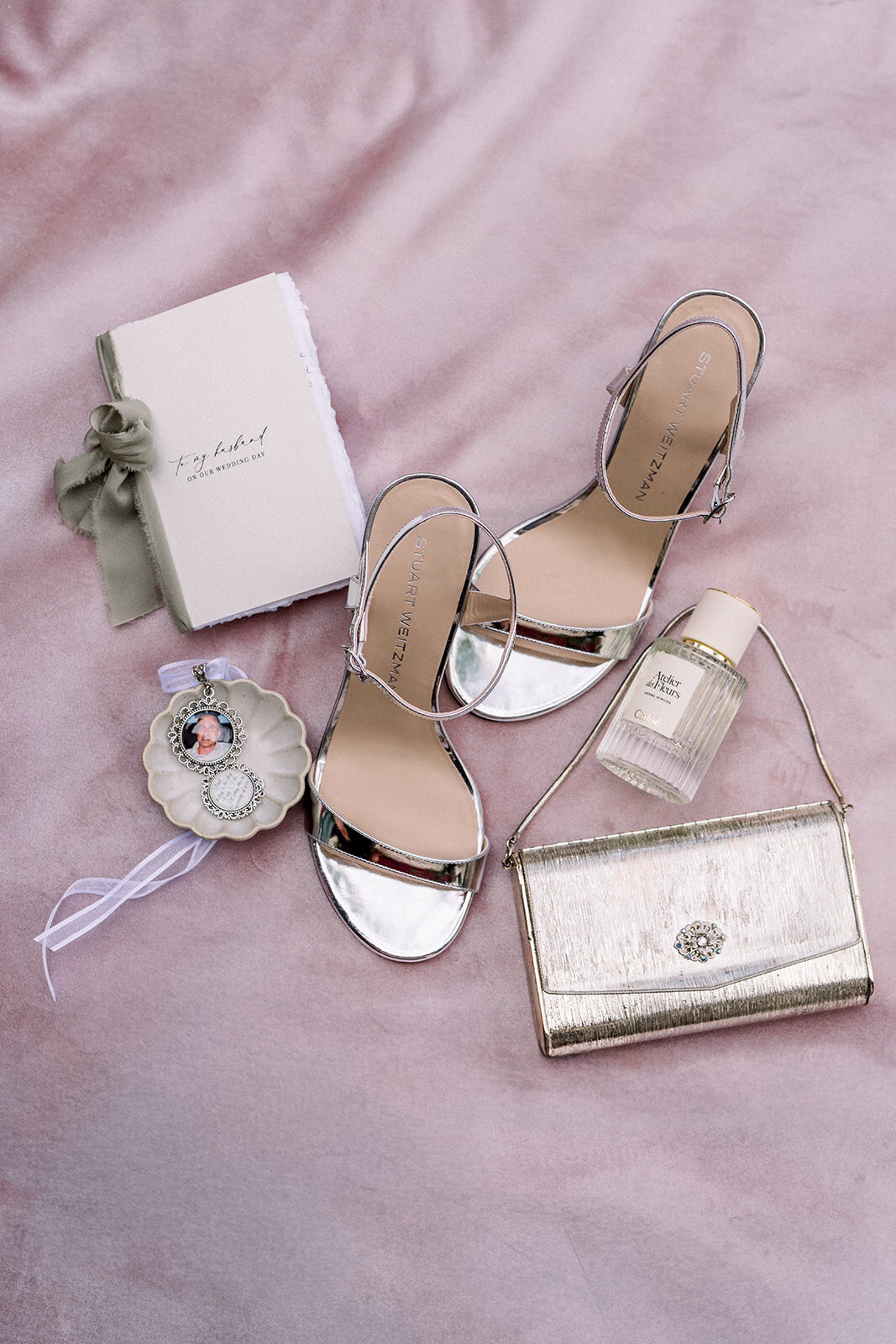 ilm wedding photography of bridal flatlay featuring shoes, rings, and invitation suite at Hummingbird Nest Ranch in Simi Valley, California.