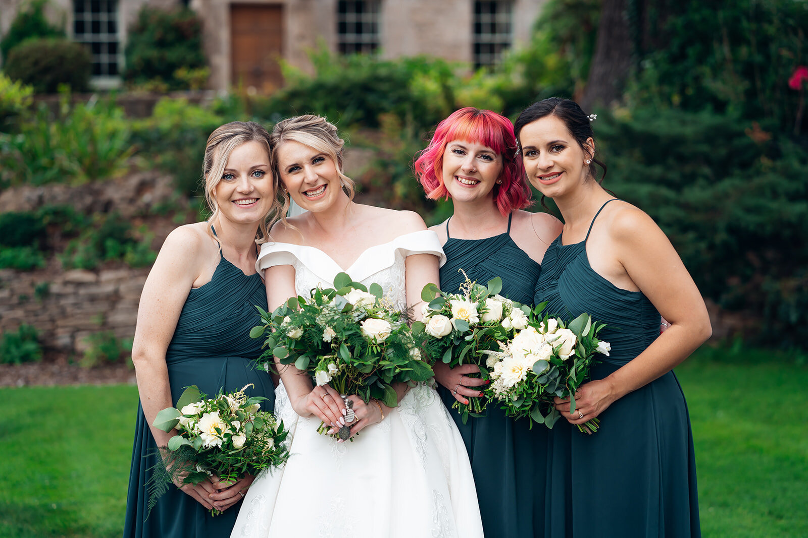 bridesmaids-bride-with-sage-green-boquets