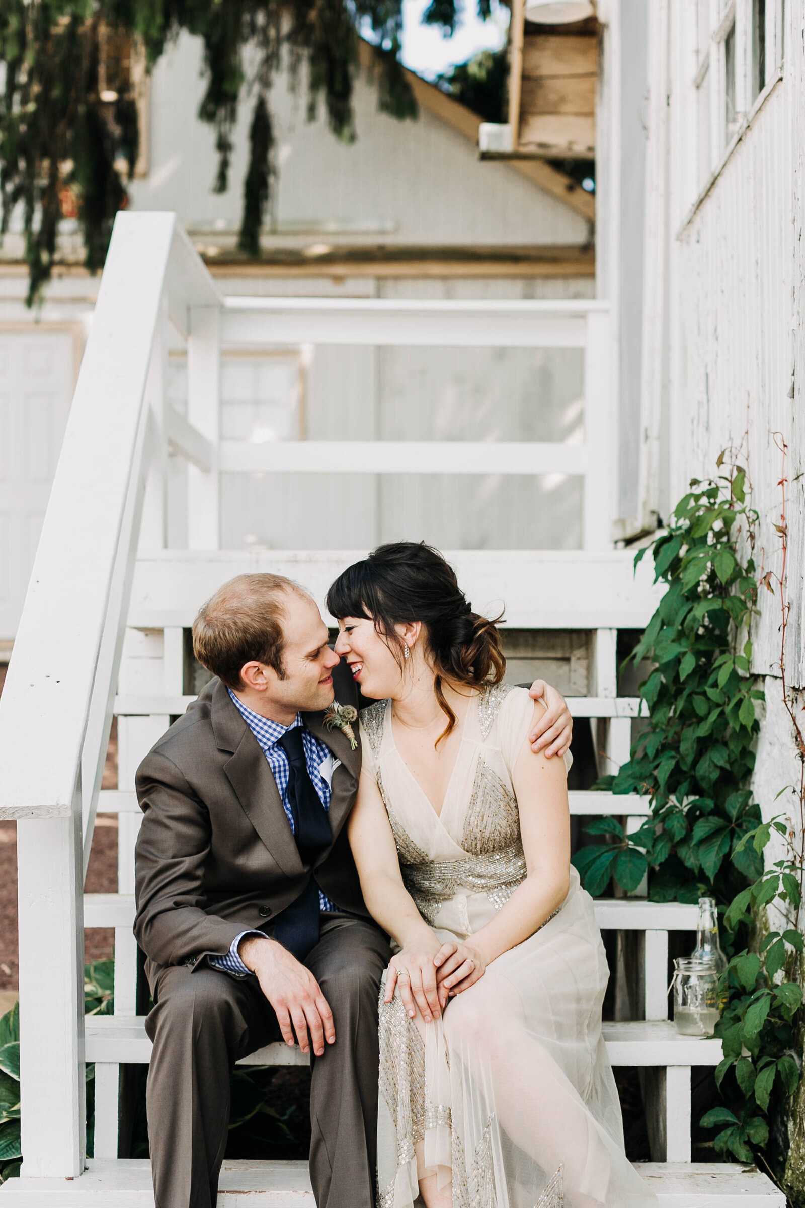 couple in vintage dress on farm steps