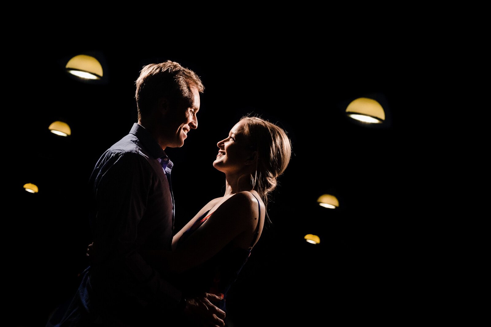dramatically lit engagement photo of a couple in Durham, North Carolina