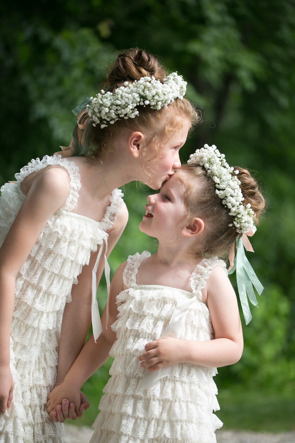 Sweet flower girls with babies breath floral crowns, in J.Crew dresses at rustic wedding in Maine