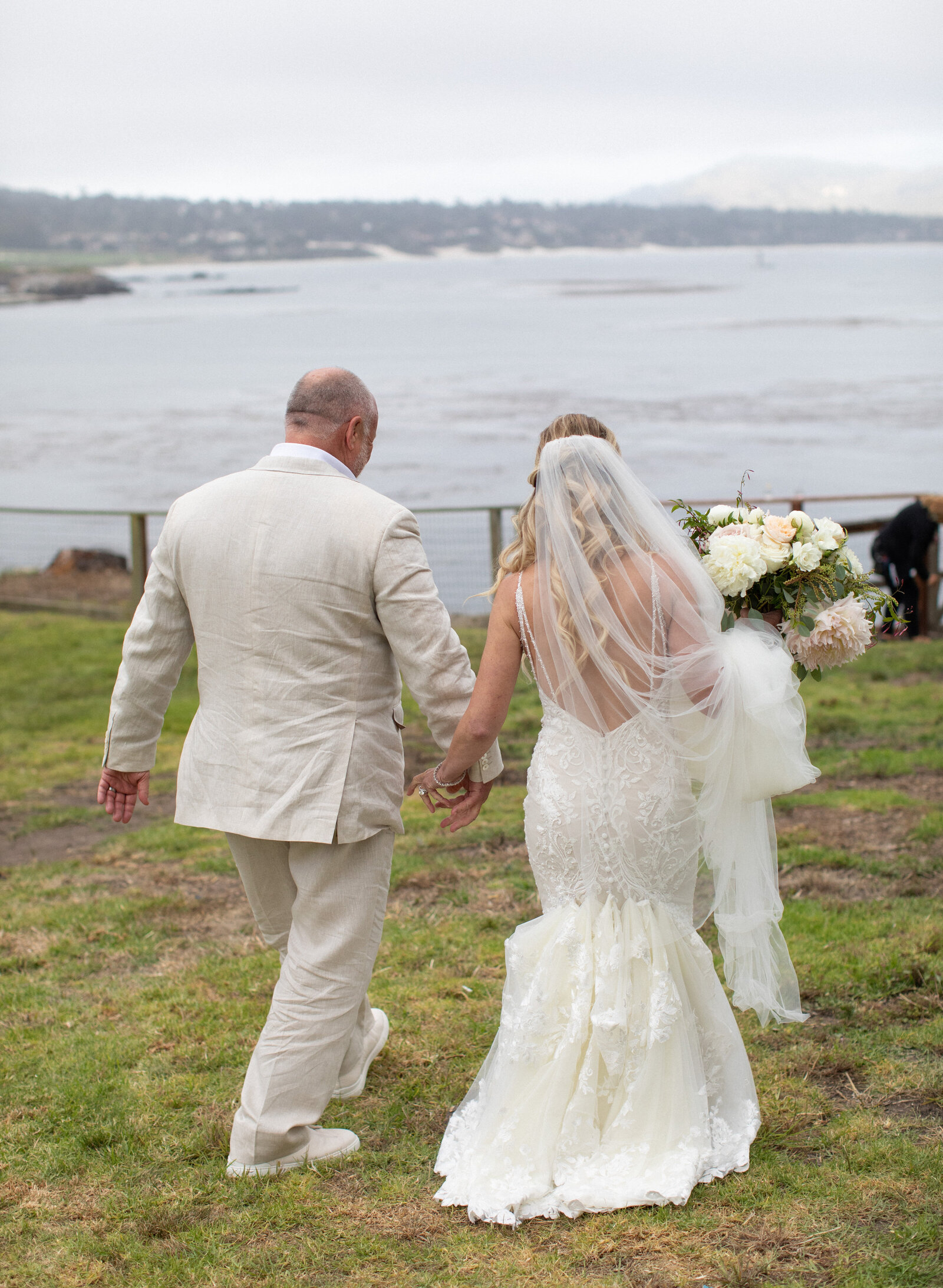 Bride and Groom Holding hands at a Private Home Wedding in Pebble Beach