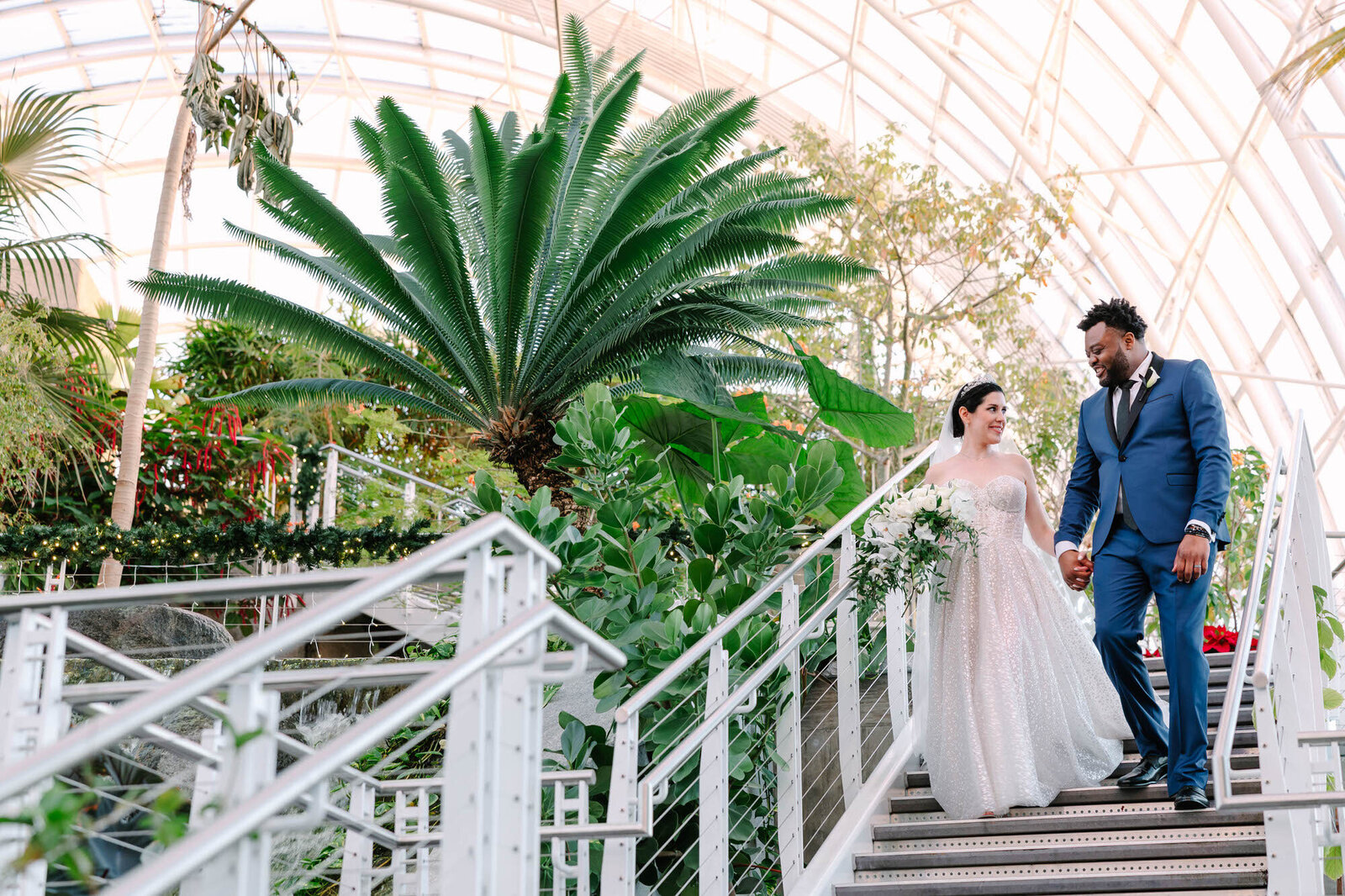 bride and groom walking down stairs at myriad gardens