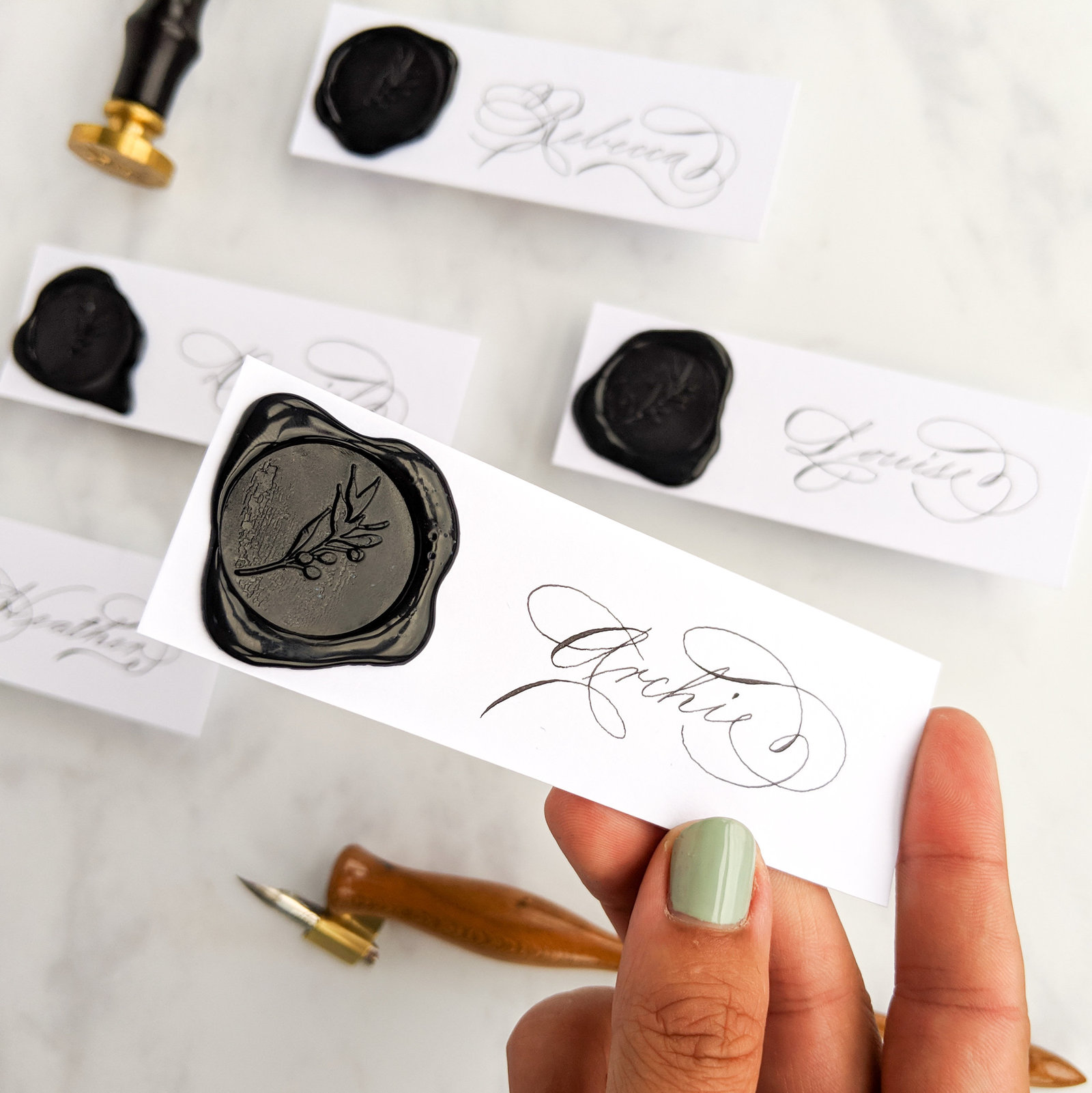 Black wax seal calligraphy place cards for Scottish wedding