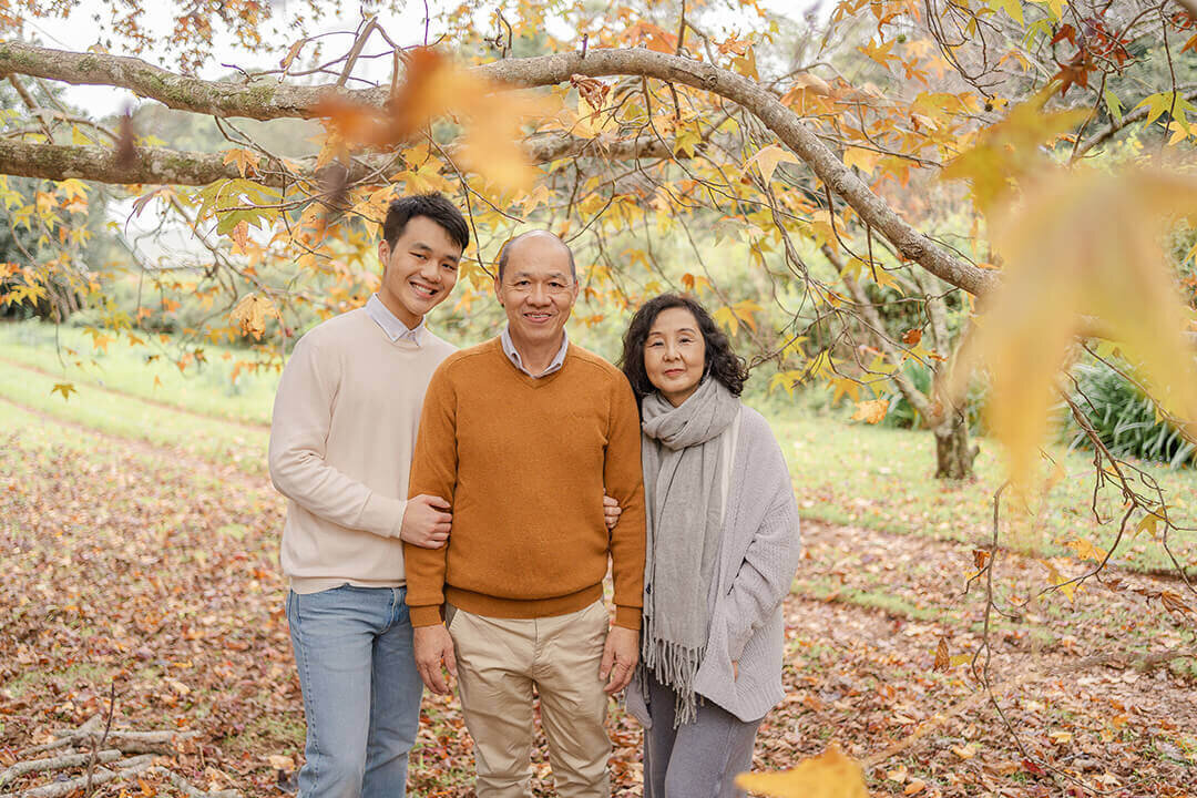 adult family photo in autumn leaves fall season in brisbane QLD
