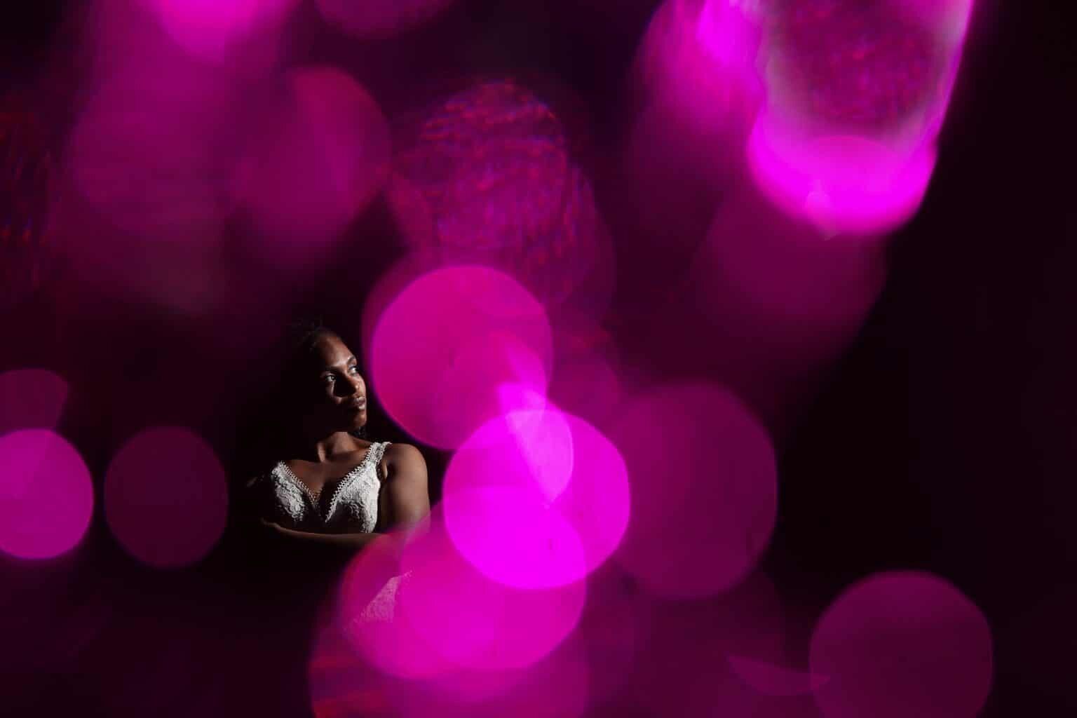 artistic portrait of bride with pink bubbles