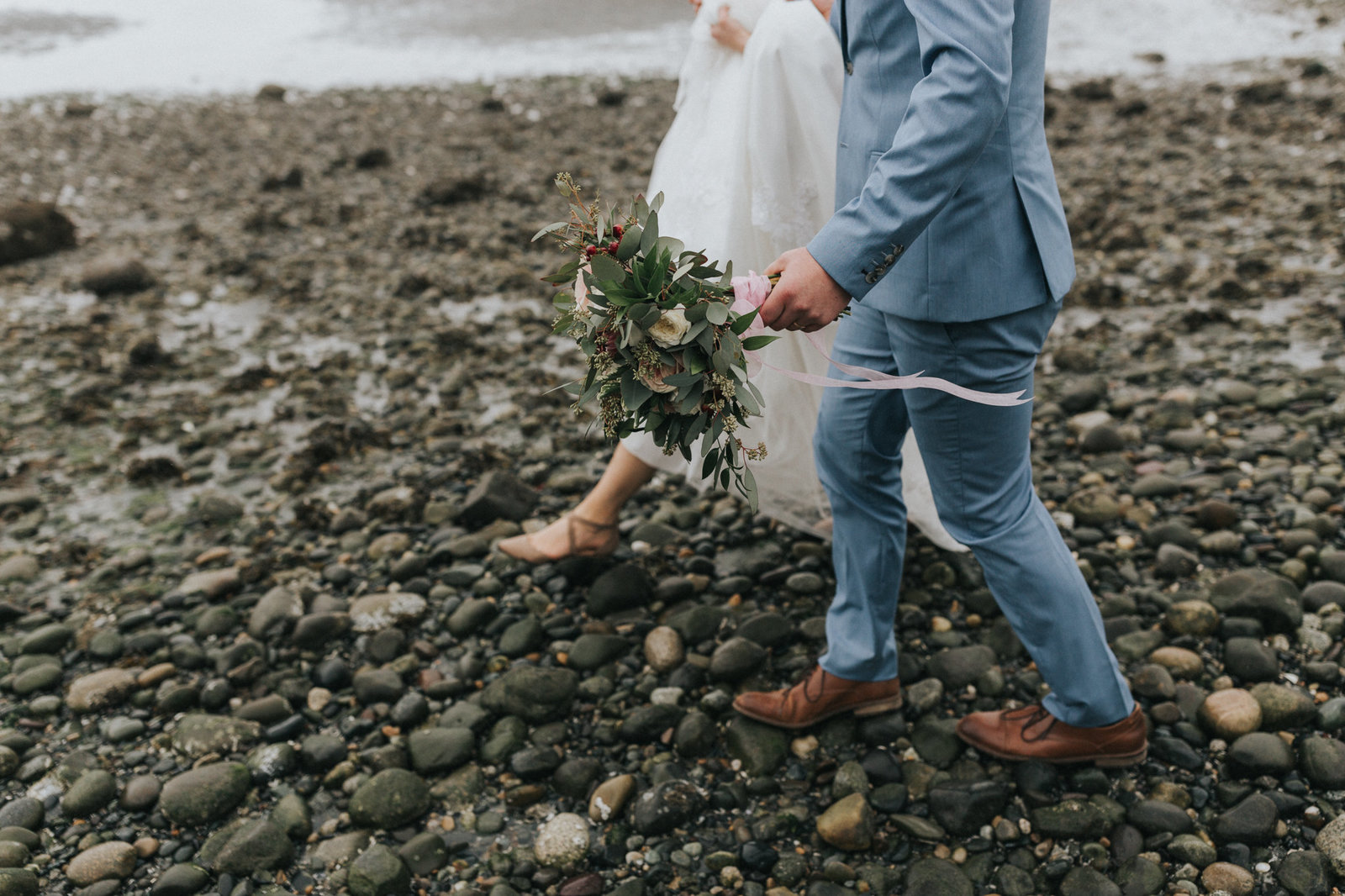 Bride and groom walking on beach in Blaine, WA