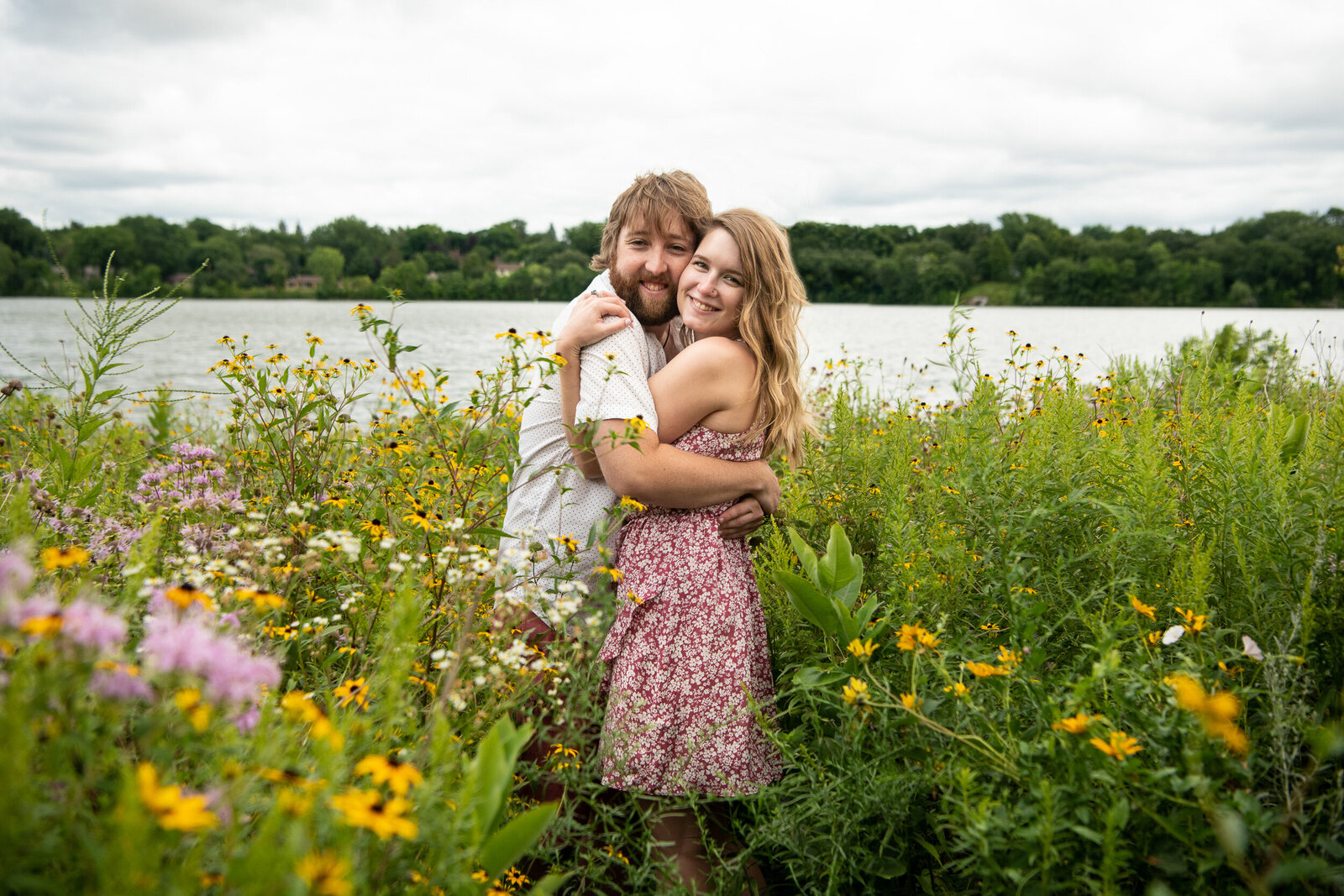 Man and woman smile in a flower field in Saint Paul, Minnesota.