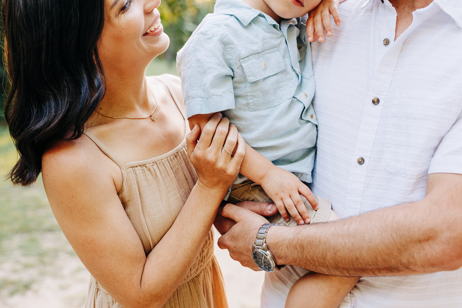 family holding toddler during their family session