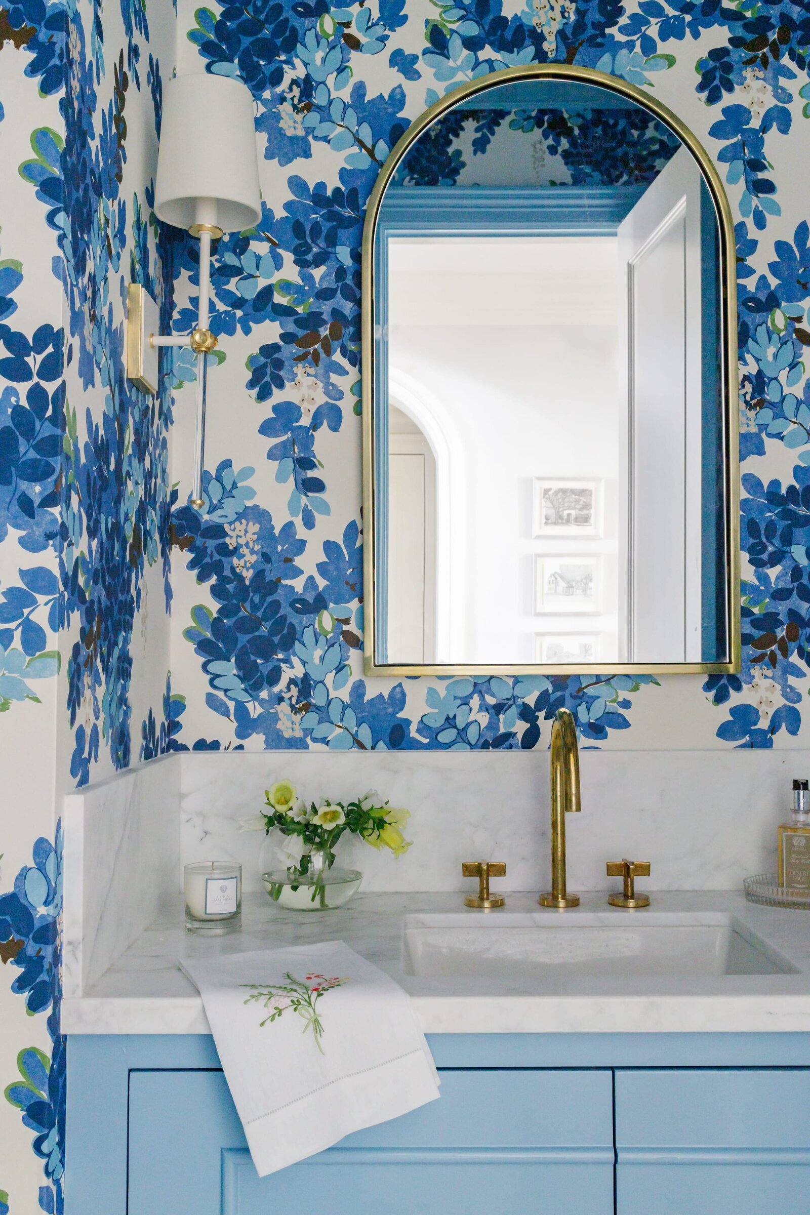 vision and hammer bathroom with blue wallpaper