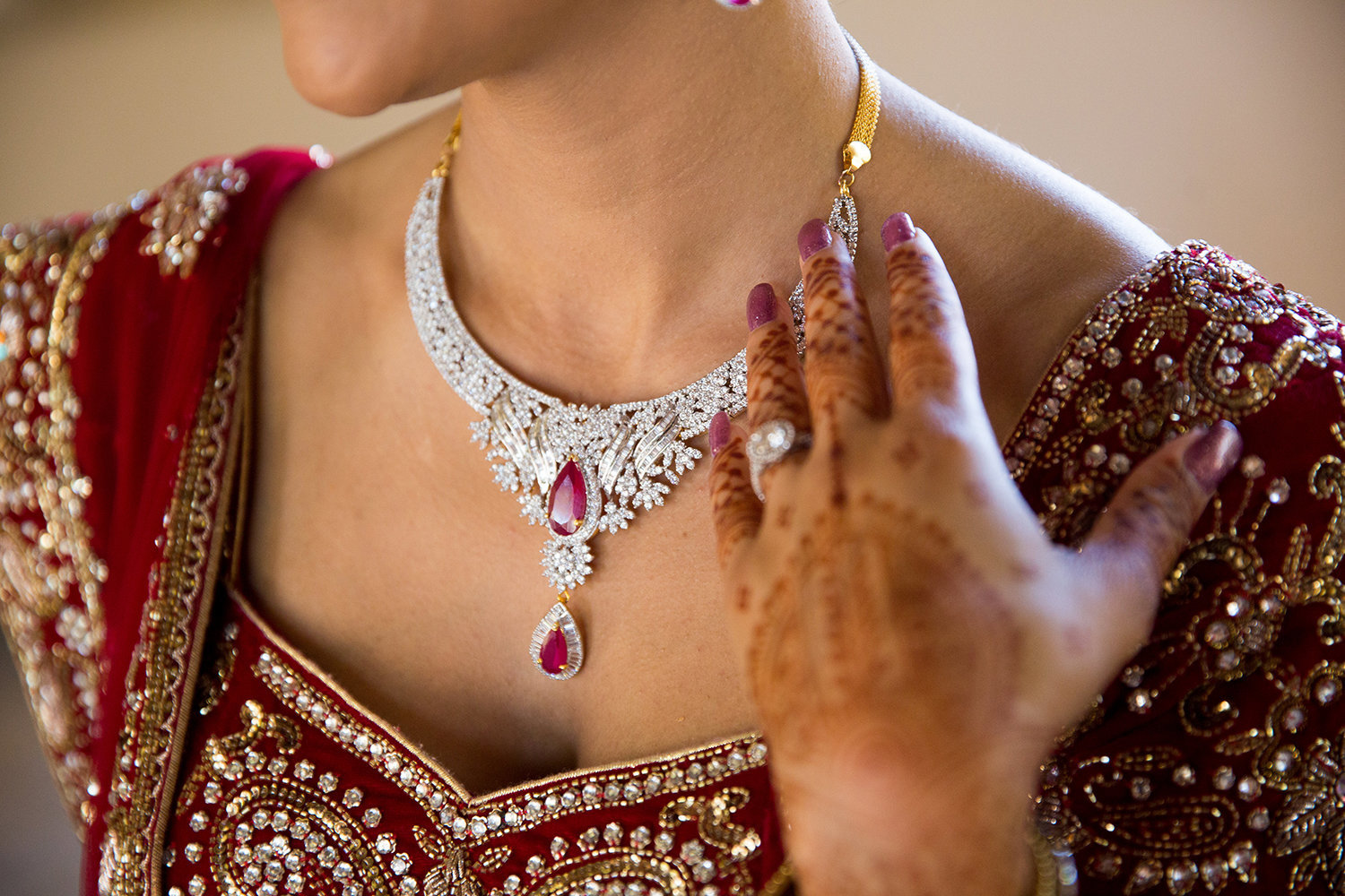 close up of jewelry and henna at a Hindu Indian cereomony