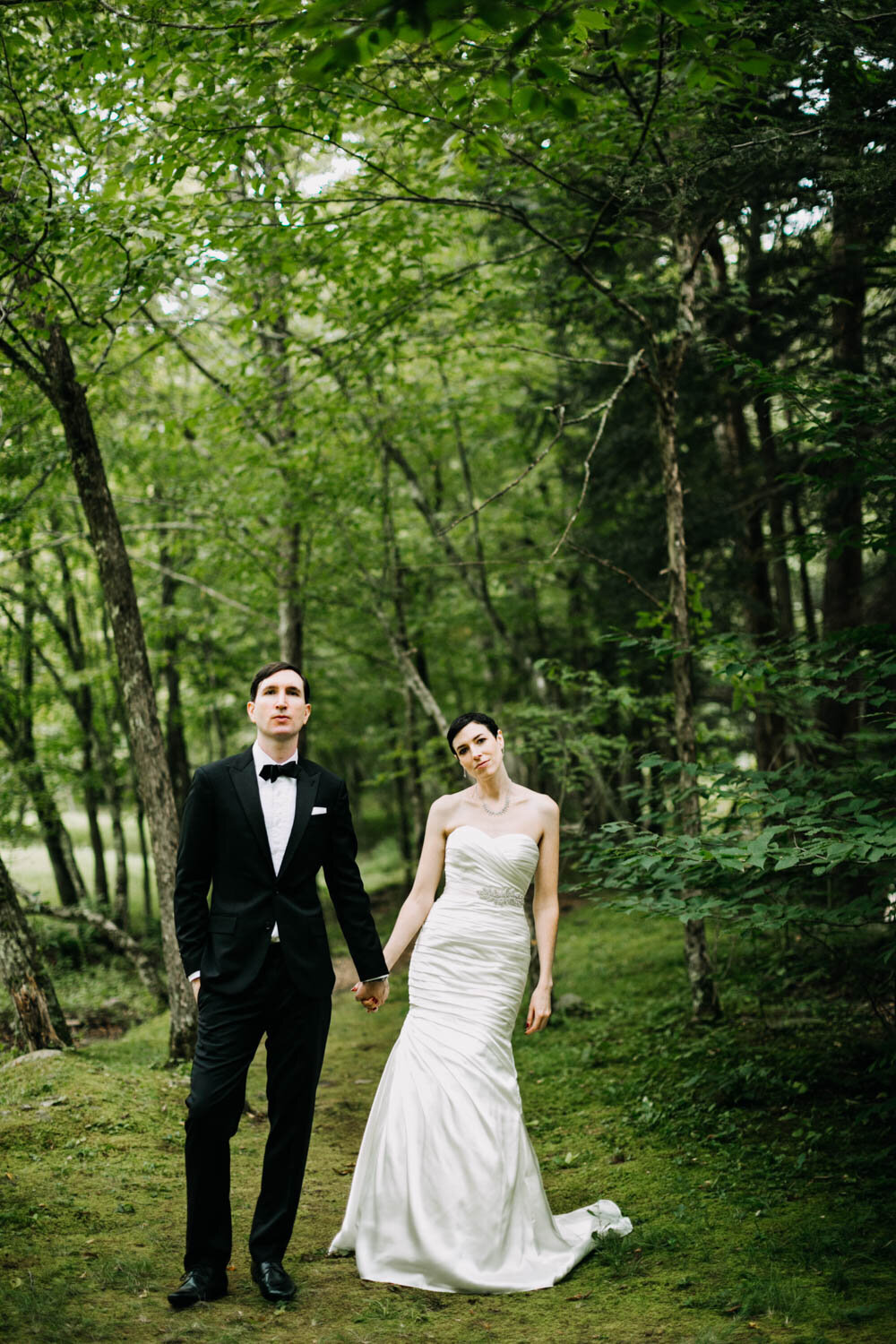 bride and groom in tux nature woods
