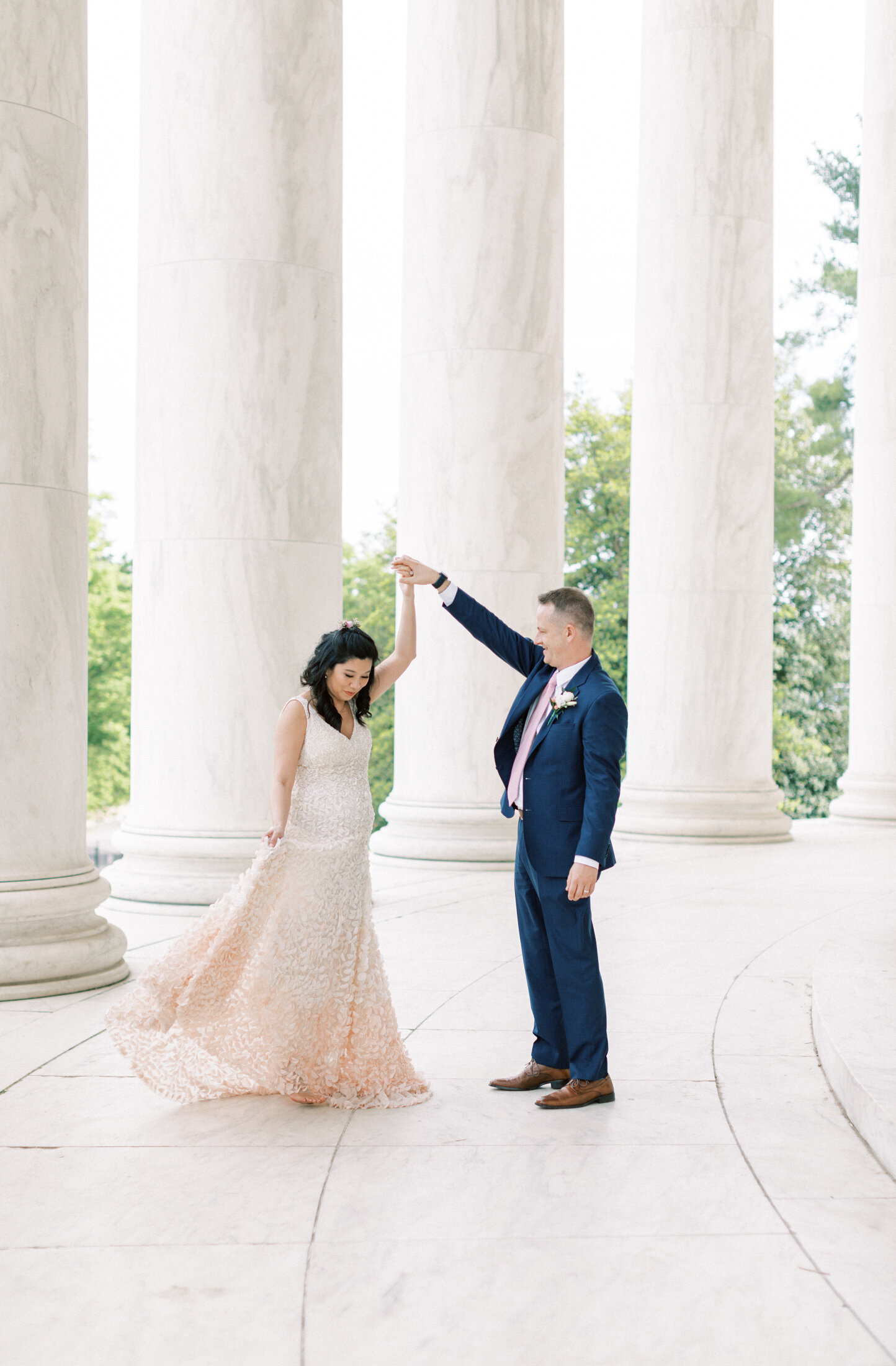 Groom spins the bride at Thomas Jefferson Monument