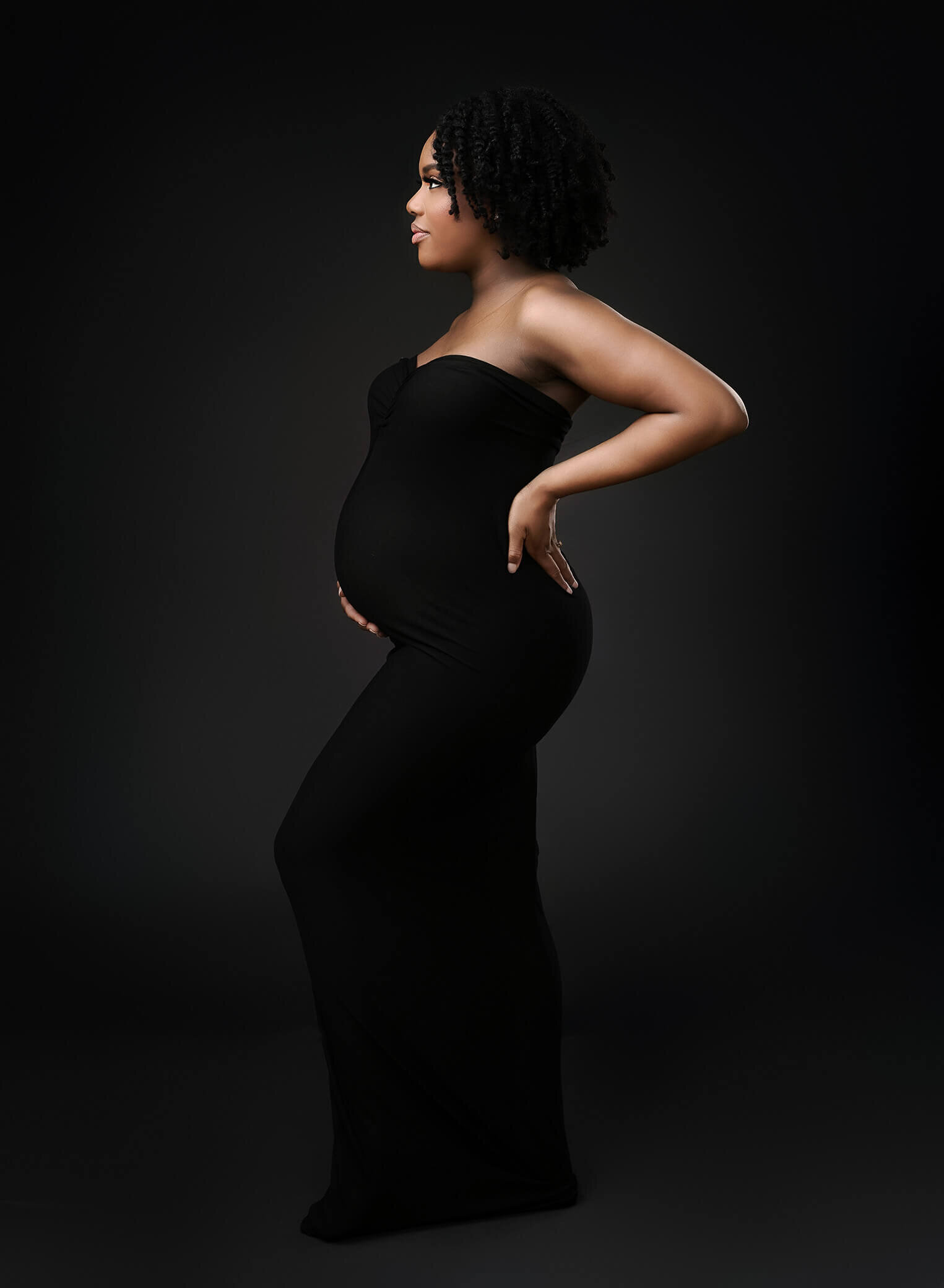 pregnant mom wearing black strapless dress
