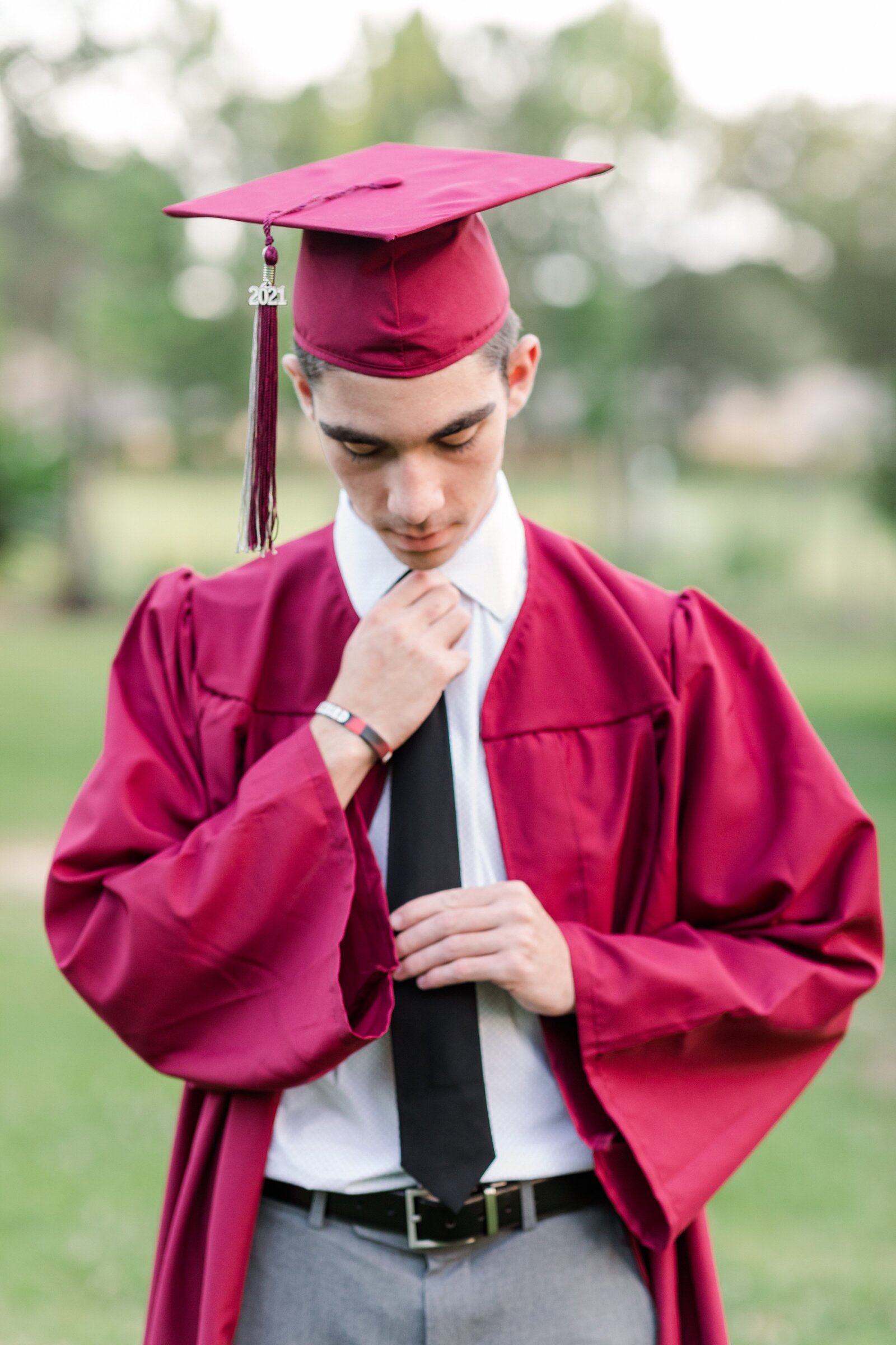 High school boy senior graduation photos with cap and gown.