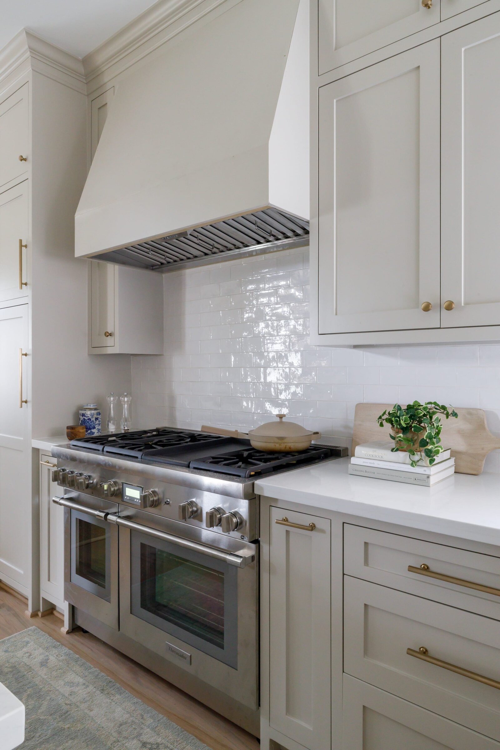 vision and hammer white kitchen with stove and white backsplash