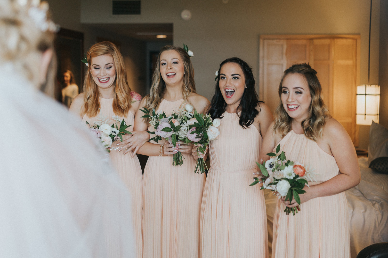 Bridesmaids seeing the bride for the first time