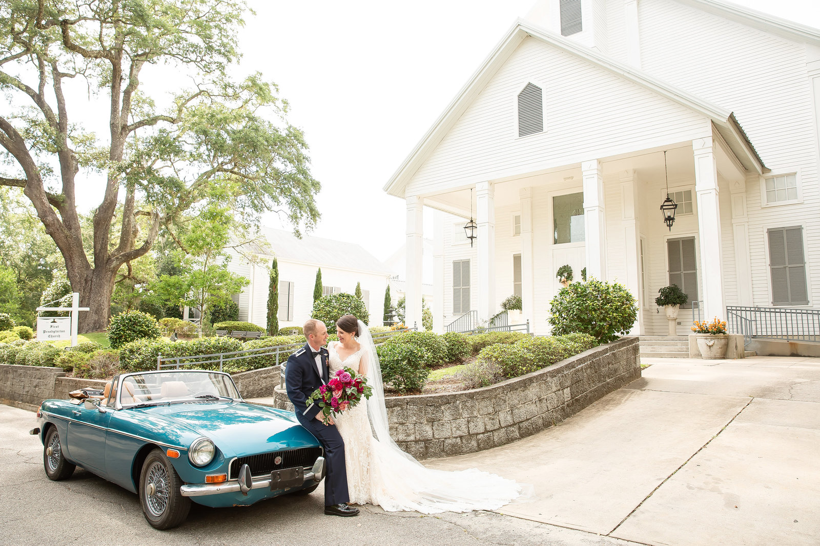 Antique car with bride and groom in Ocean Springs MS