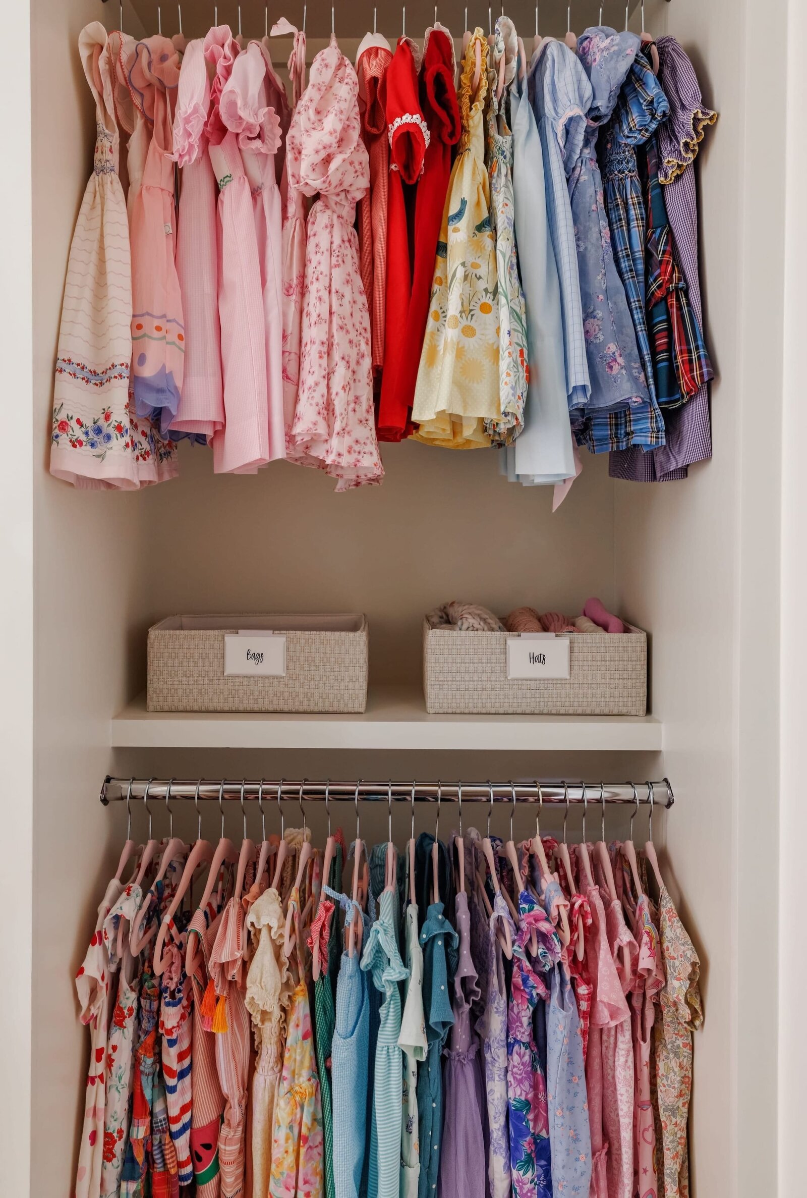 vision and hammer organizing girls closet with hanging dresses