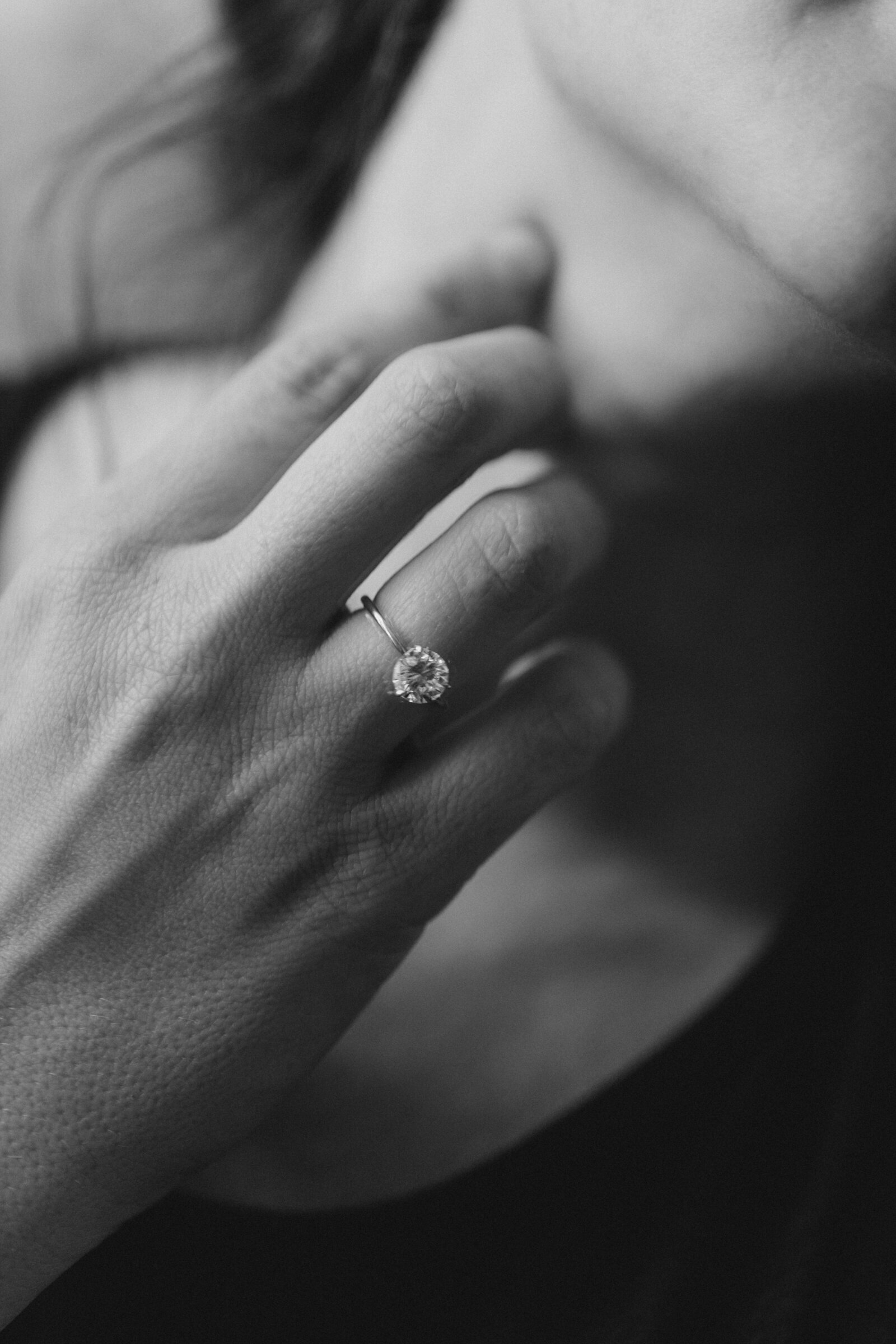 engagement ring on a finger