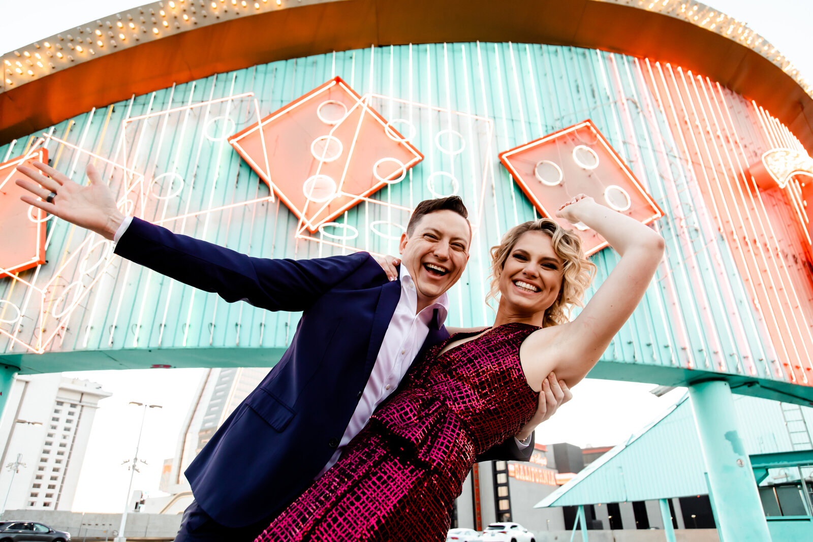 This couple posed in front of Neon signs for their Downtown Las Vegas engagement session