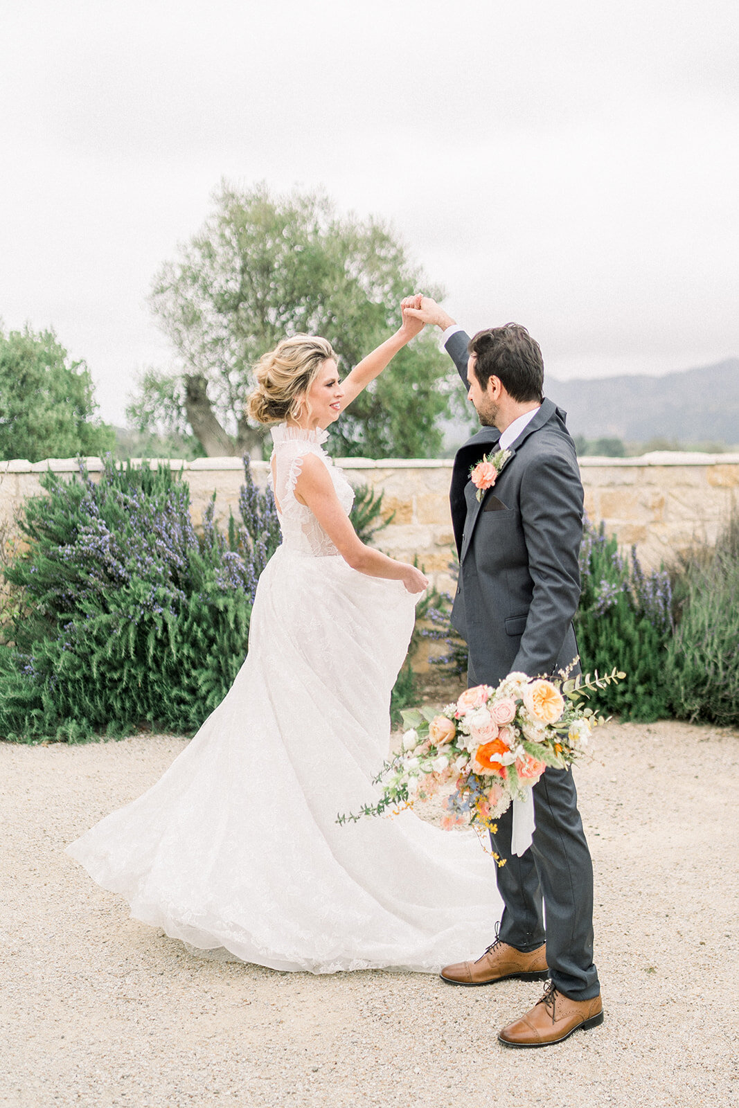 Bride and groom dancing at Sunstone Winery in Santa Ynez, CA