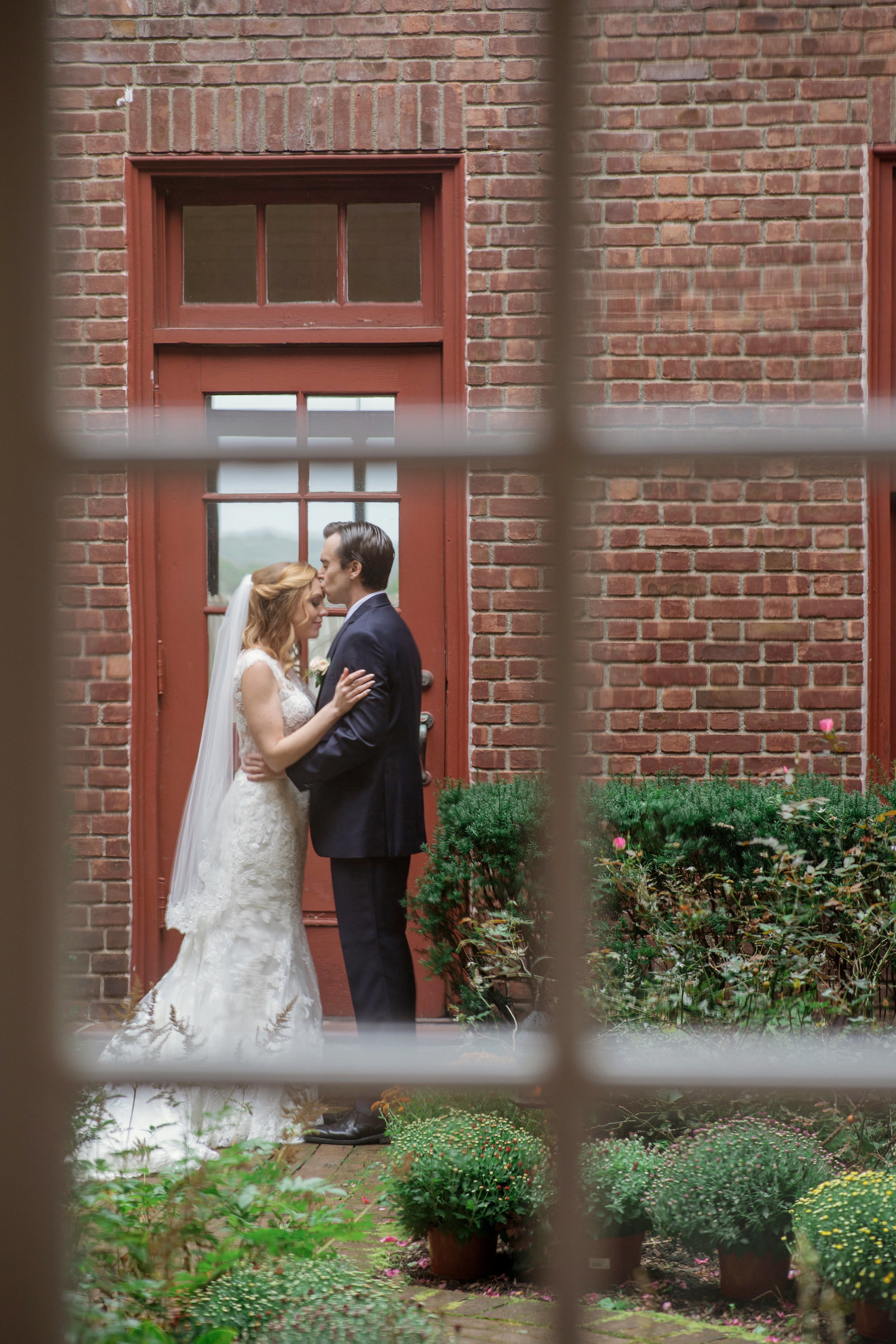bride getting kiss on forehead photo at Coindre Hall