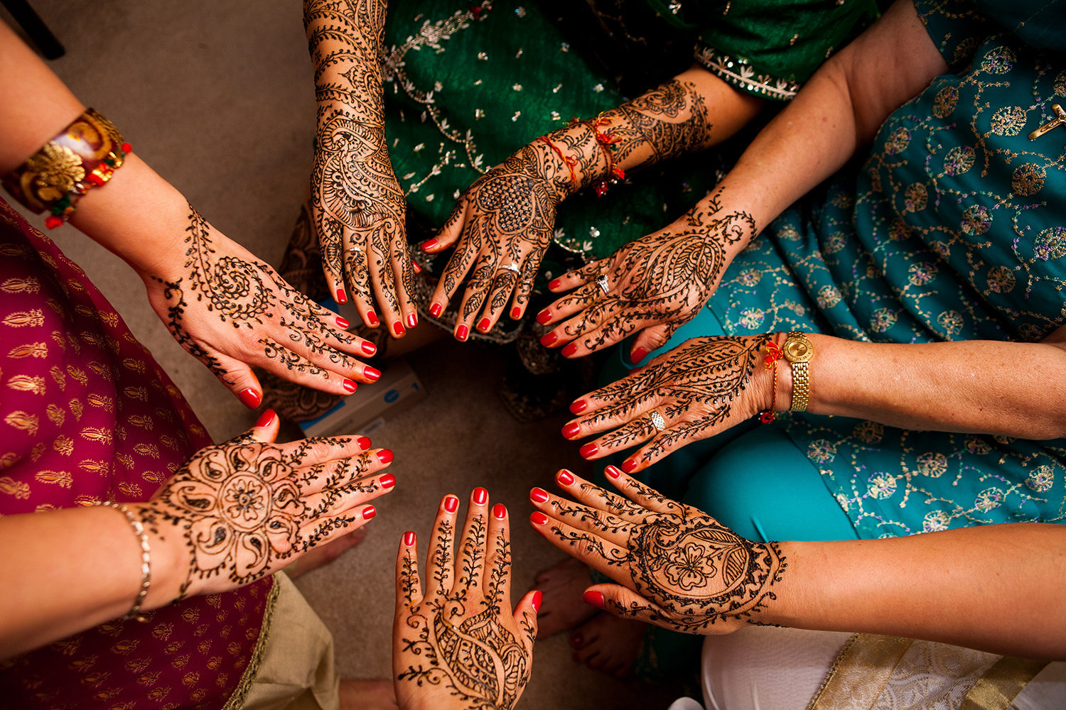 Detail of bride and bridesmaids henna before a hindu wedding ceremony