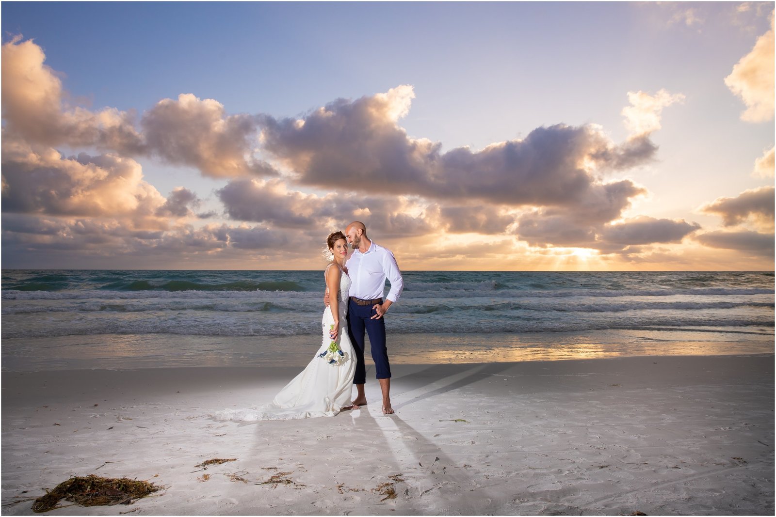 Bride and Groom on Holmes Beach at sunset