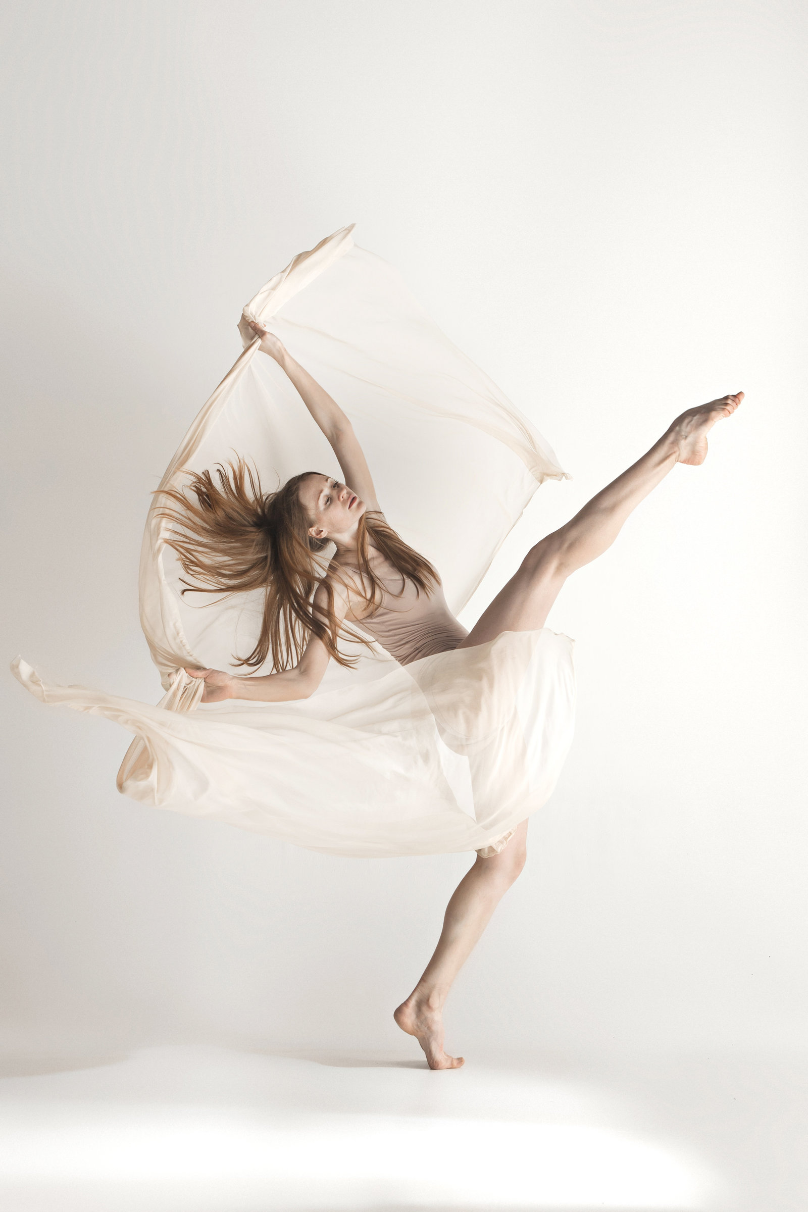 young-beautiful-dancer-in-beige-swimsuit-dancing-PTXNHCA