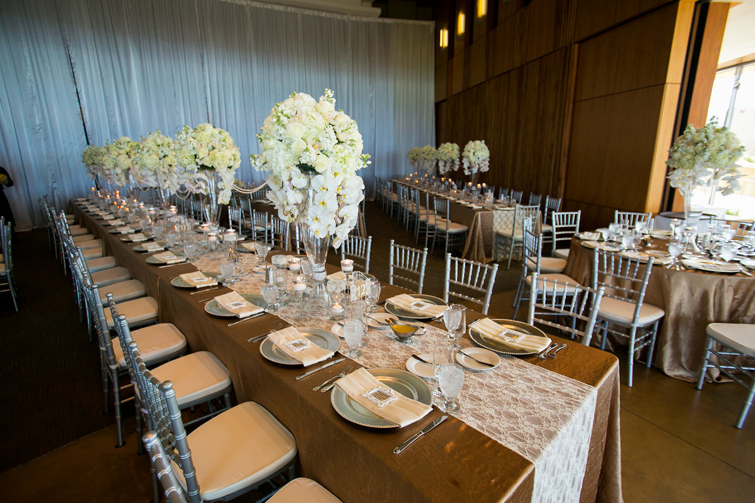 long tables with white flowers