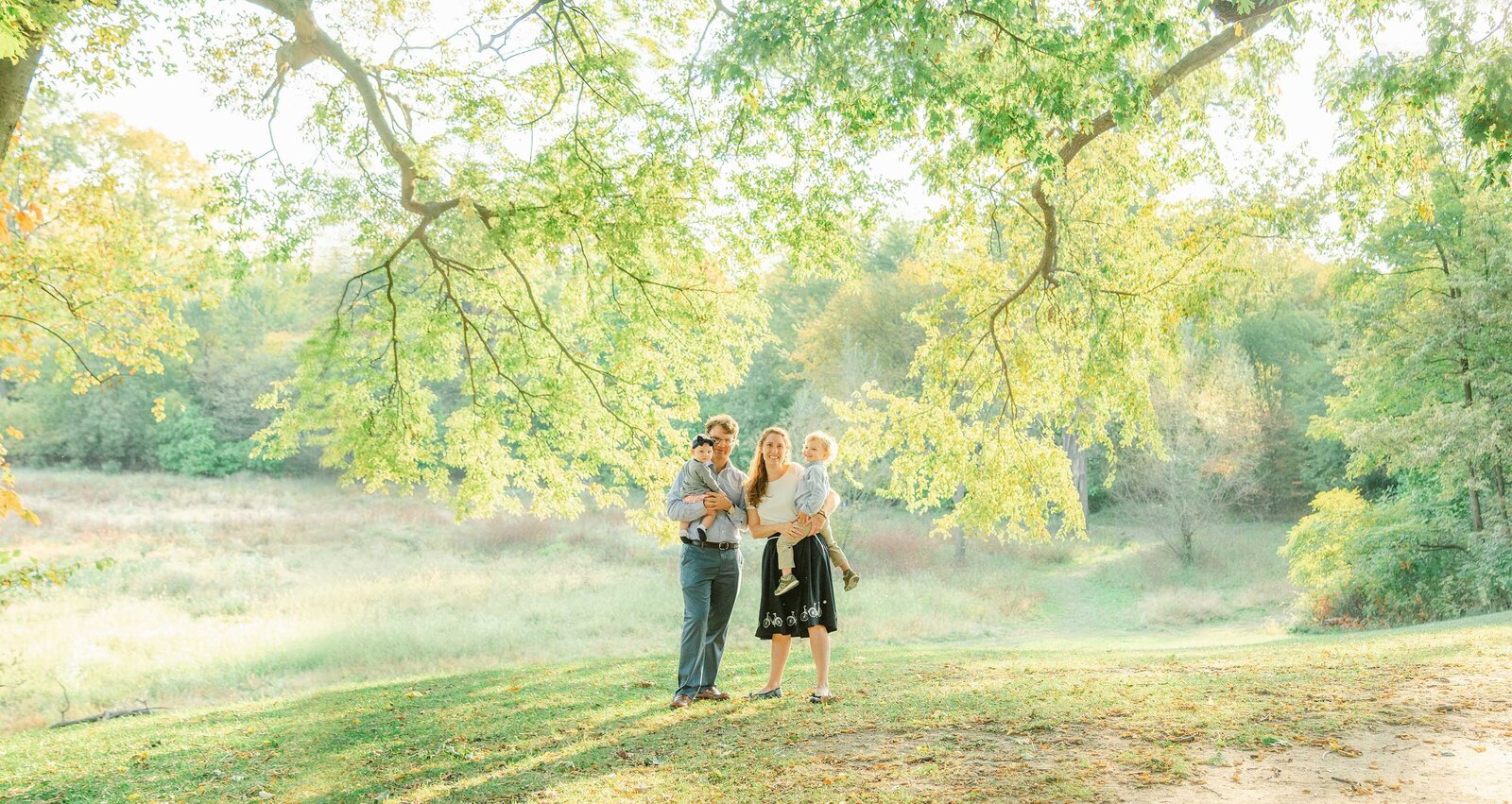 Young family of four taking fall photos in Riverside, IL by Chicago Family Photographer Kristen Hazelton
