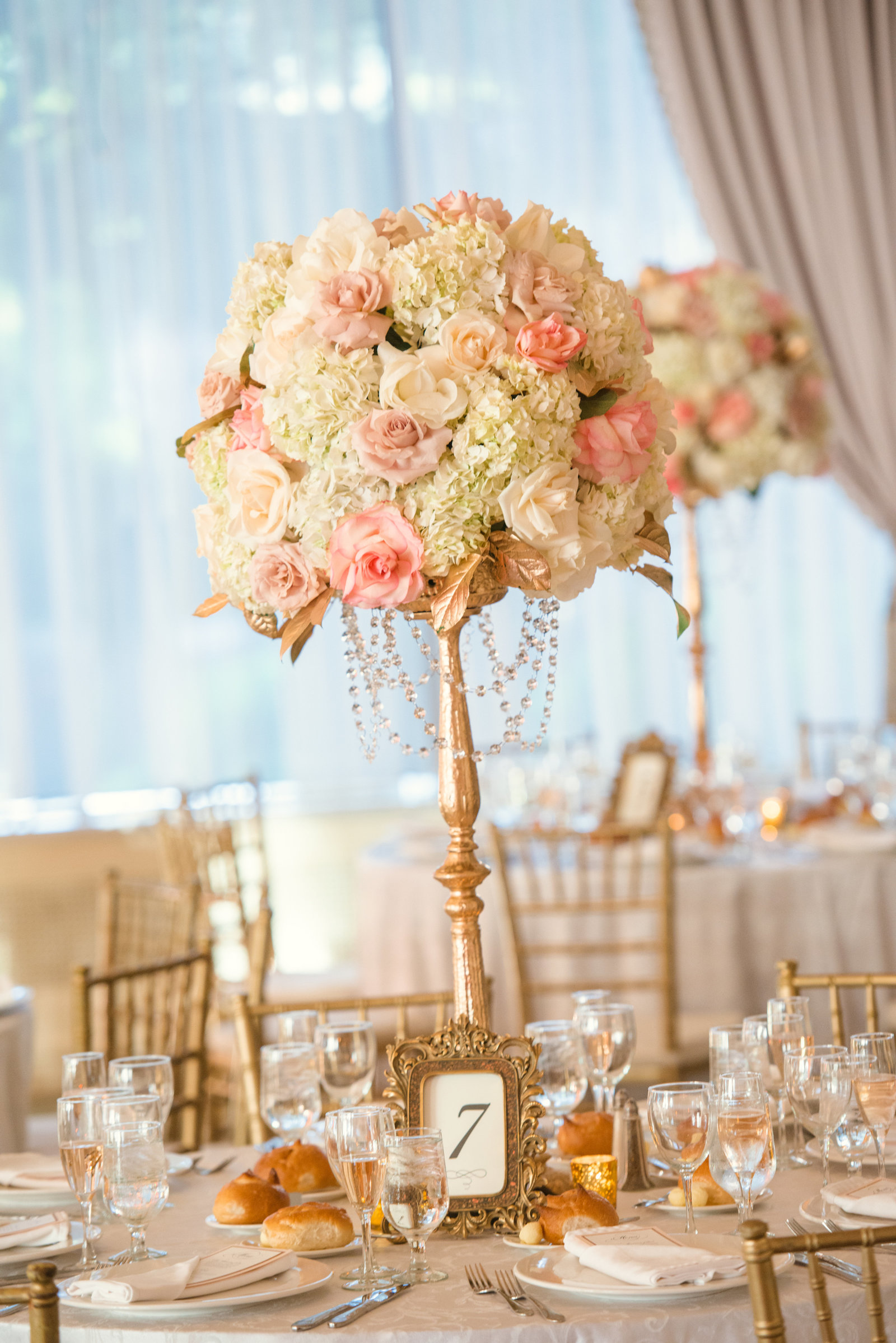 Wedding centerpiece of white and pink flowers at Glen Cove Mansion