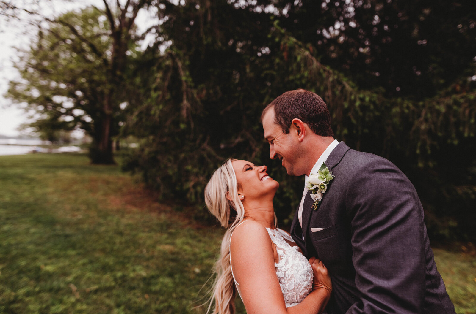 newlyweds portrait photography on a waterfront venue in Maryland, rainy day spring wedding photography