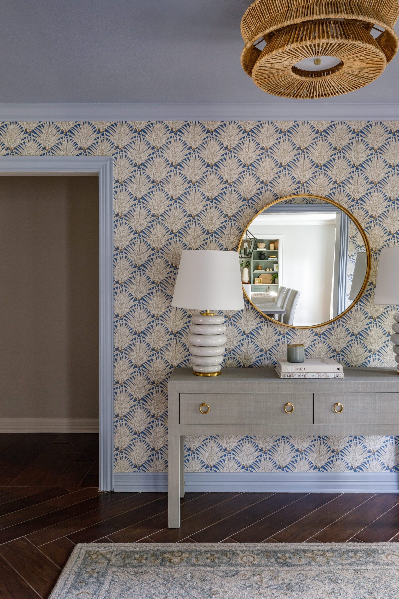 vision and hammer entryway table with gold round mirror and wallpaper