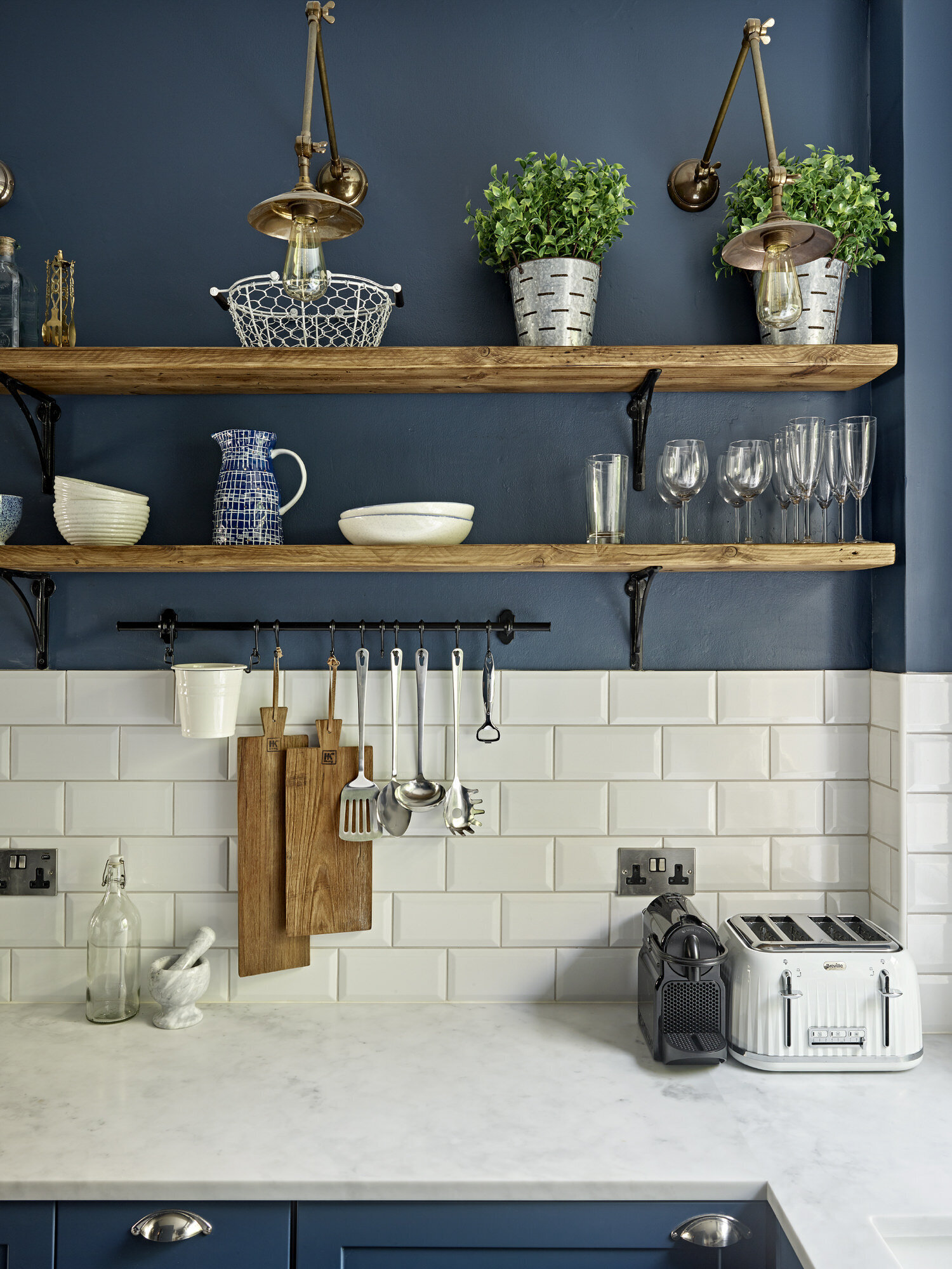 Navy kitchen wall with wooden open shelving concept