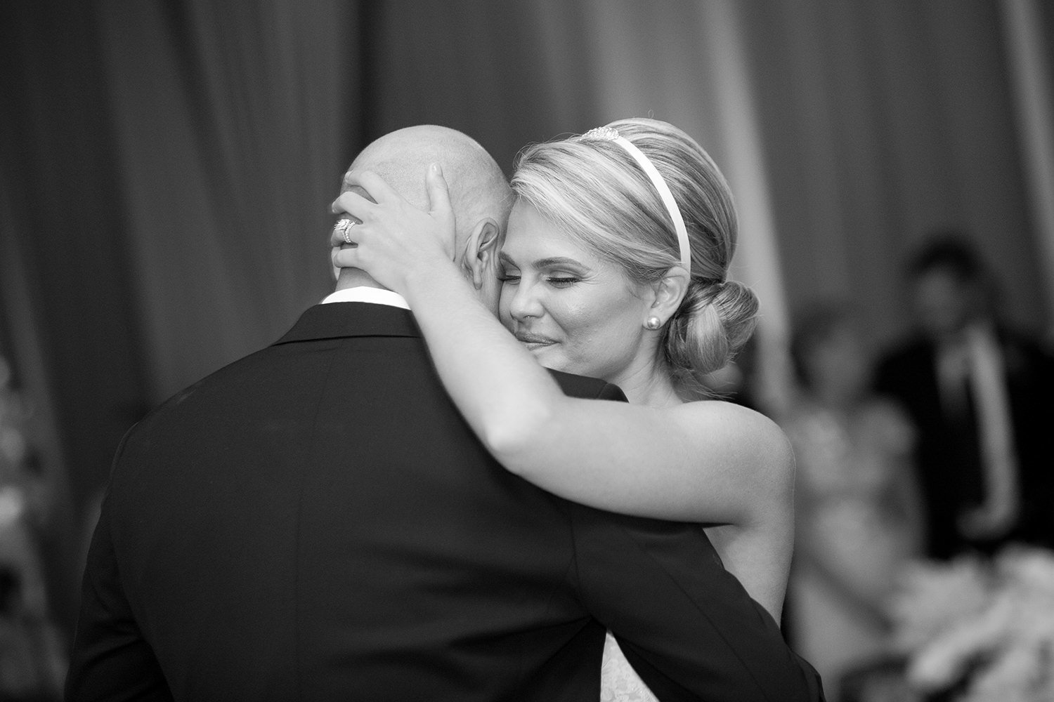 Emotional moment between the bride and her father during the father daughter dance