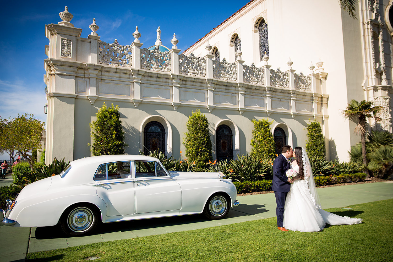 bride and groom at the immaculata with a classic car