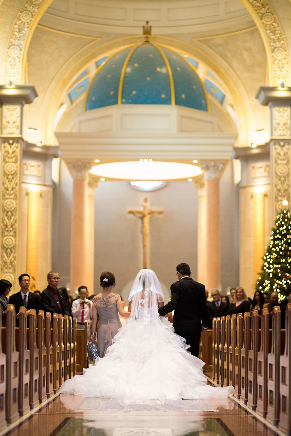 bride with father walking down the aisle at the immaculata