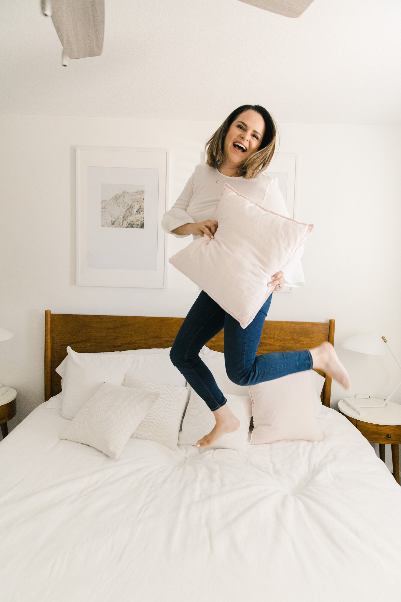 girl jumping on the bed