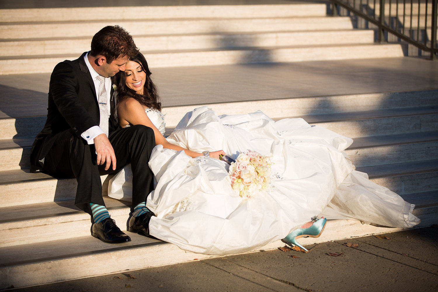 Romantic posing idea for bride and groom with stairs