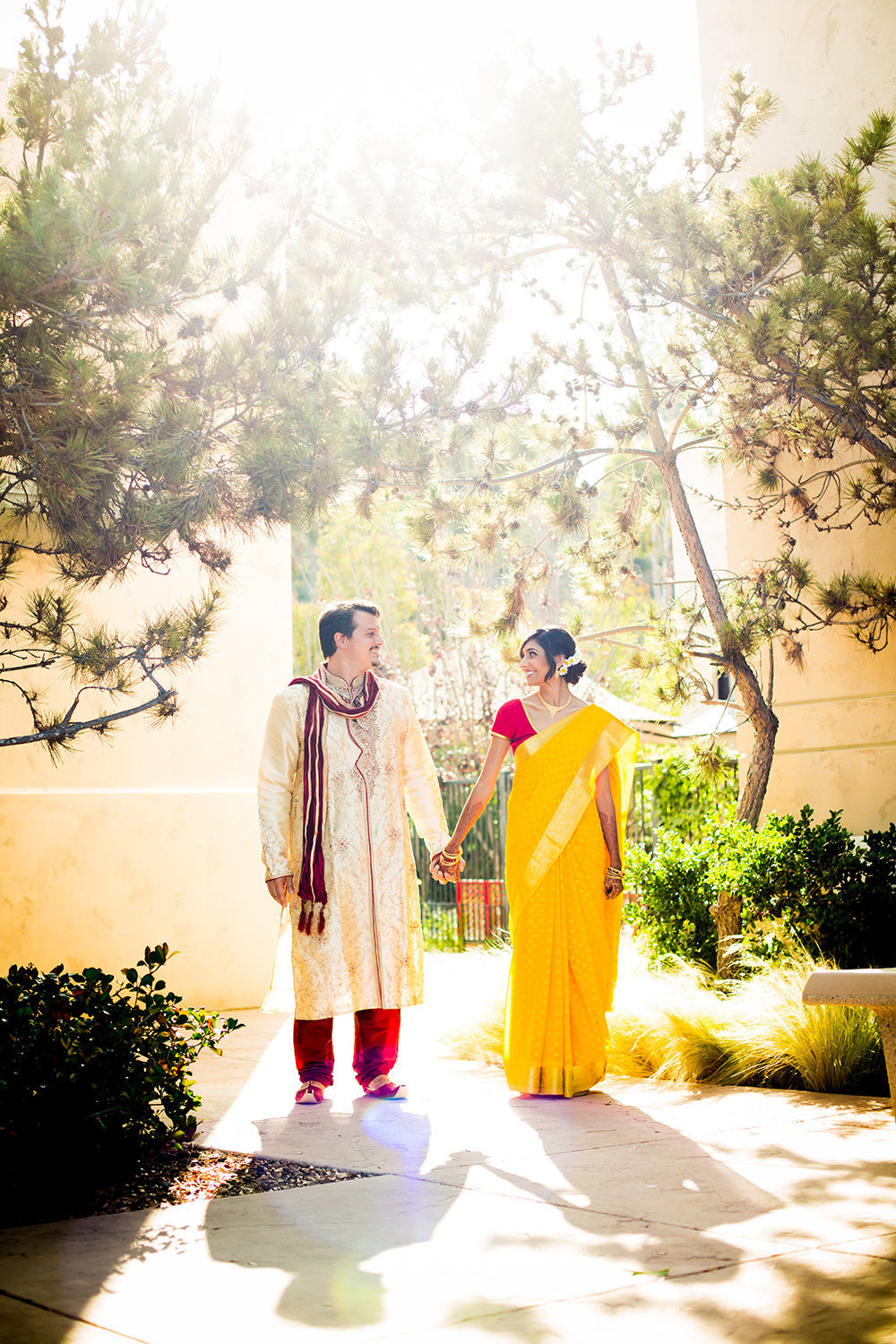 Cute Pose for Indian Hindu Couple with Bride in Sari and Groom in Sherwani