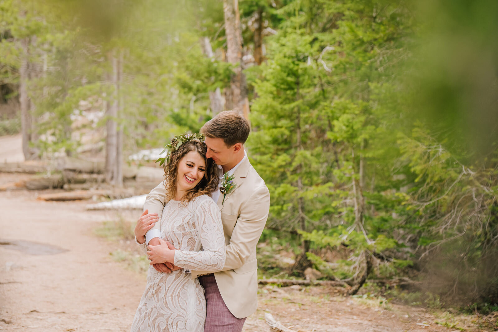 bride and groom hugging and smiling during jackson hole wedding photography