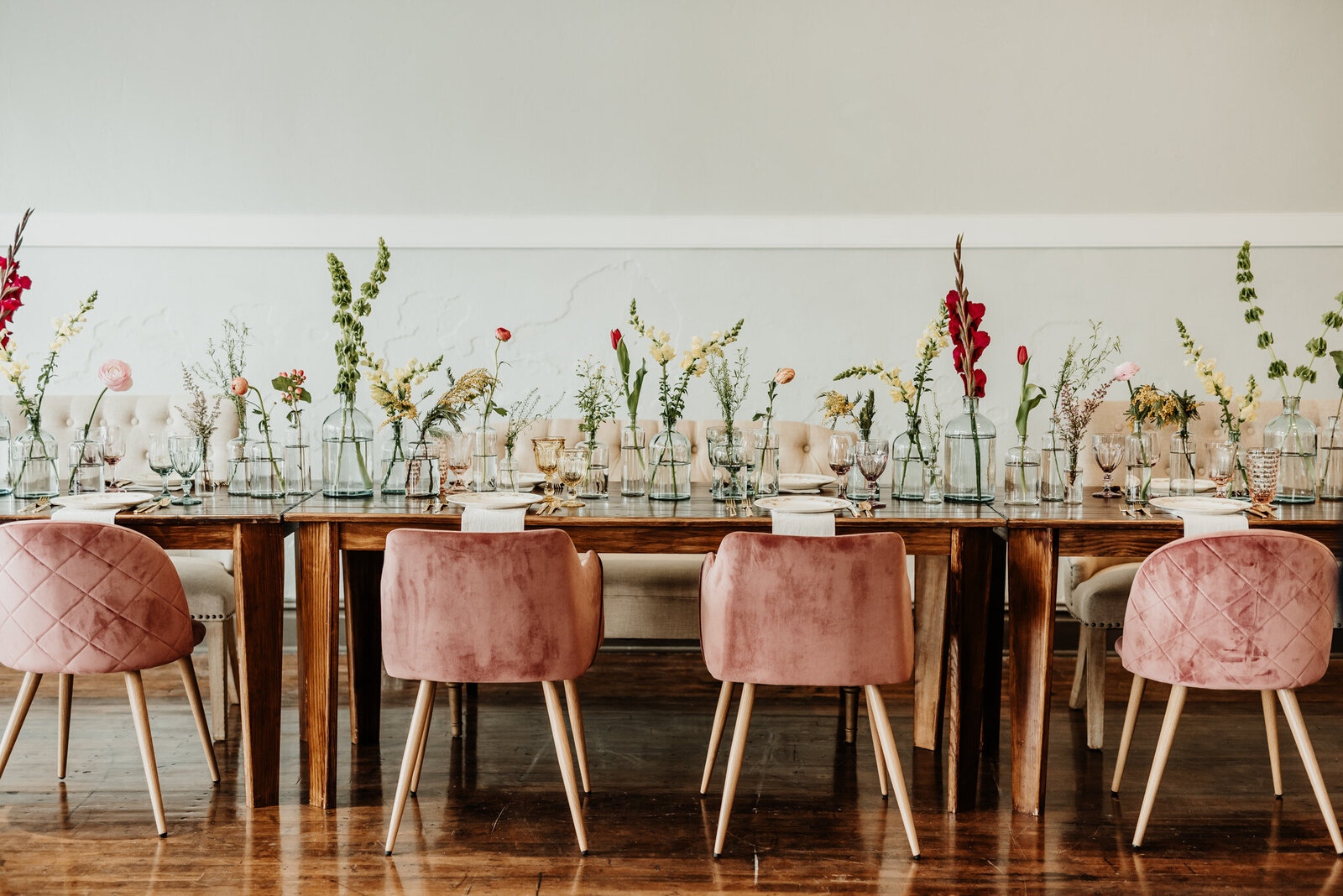 Tablescape with vintage vibes, glass vases and flowers.