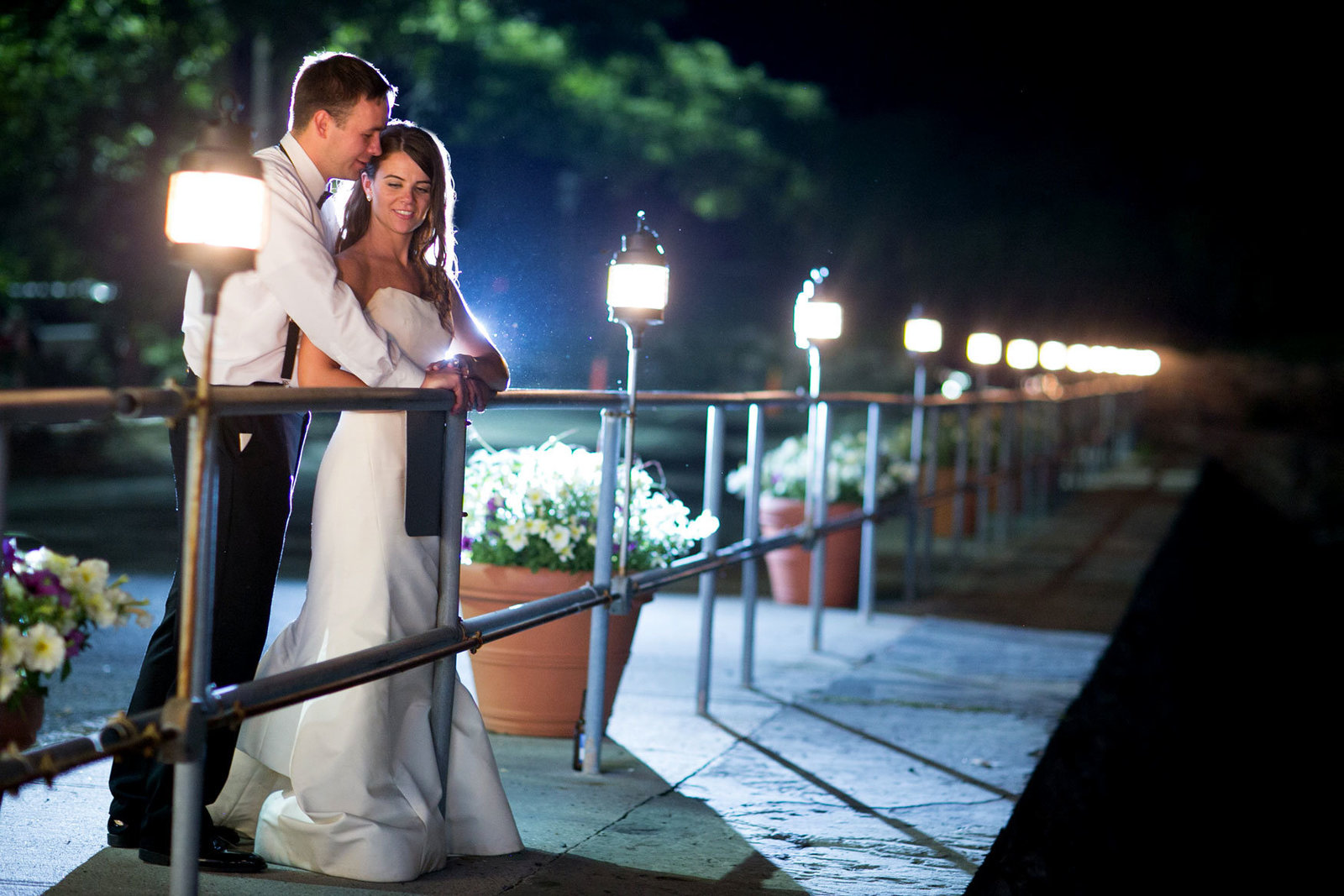 bride and groom outside Glen Island Harbor Club at night