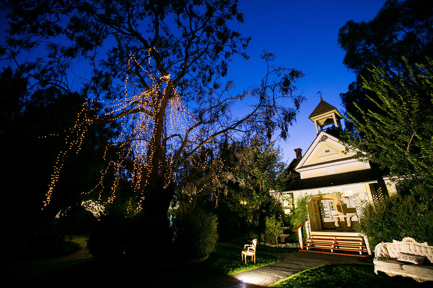 Twin Oaks Schoolhouse lit up at night