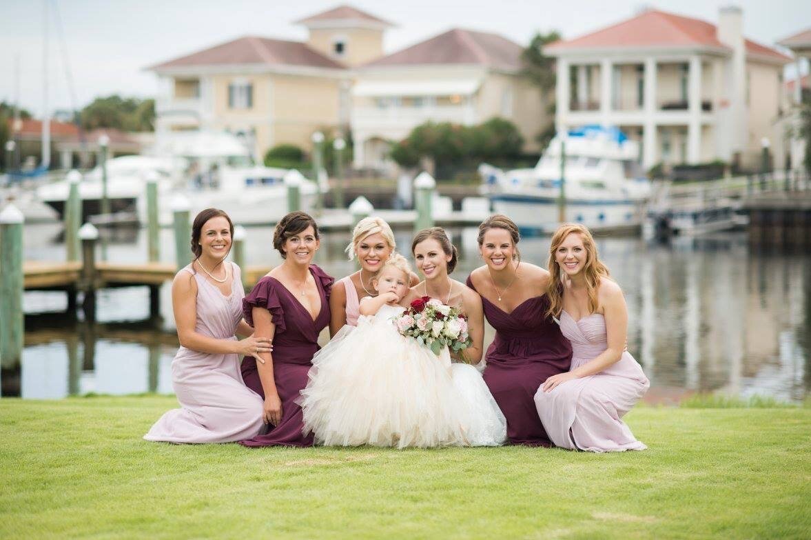 Venue Waterfront in Pensacola wedding posing with bride and her girls at Venue Palafox Wharf Waterfront Wedding Venue