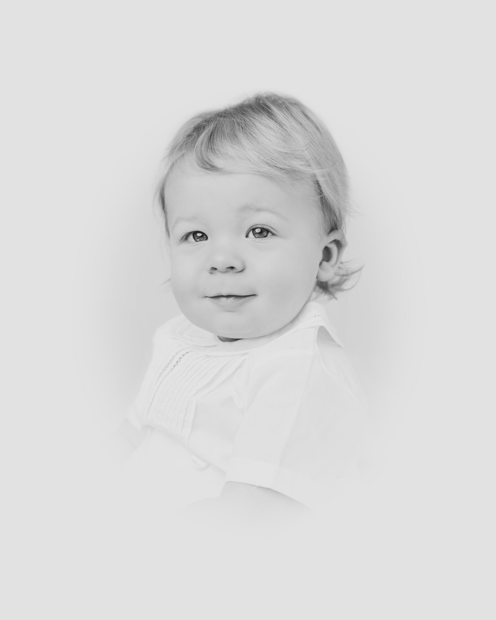 Black and white portrait of toddler boy taken at the Worth Capturing Photography studio in Raleigh NC